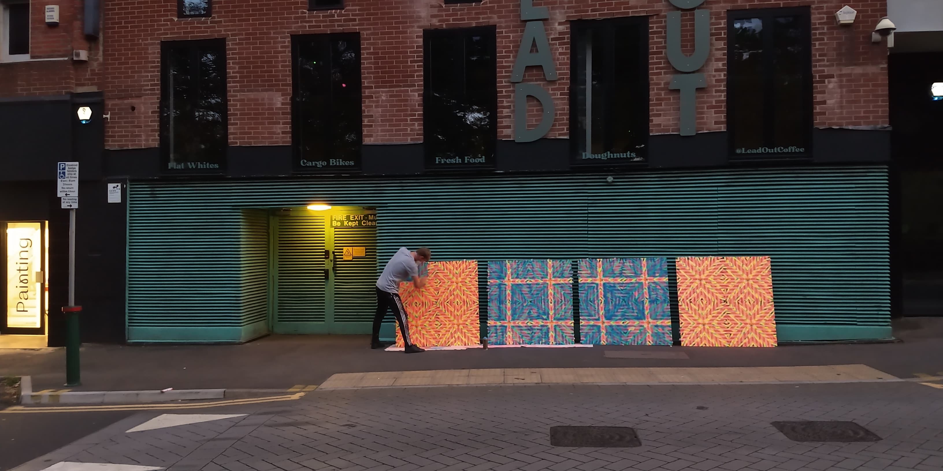 Student from MA Painting working on large-scale work outside in Bournemouth