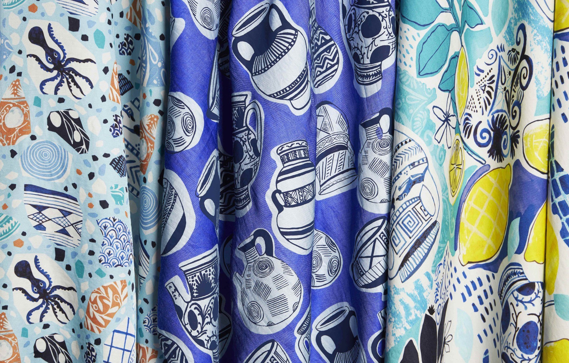 Fabric printed with Greek-inspired patterns including vases, lemons and a squid.