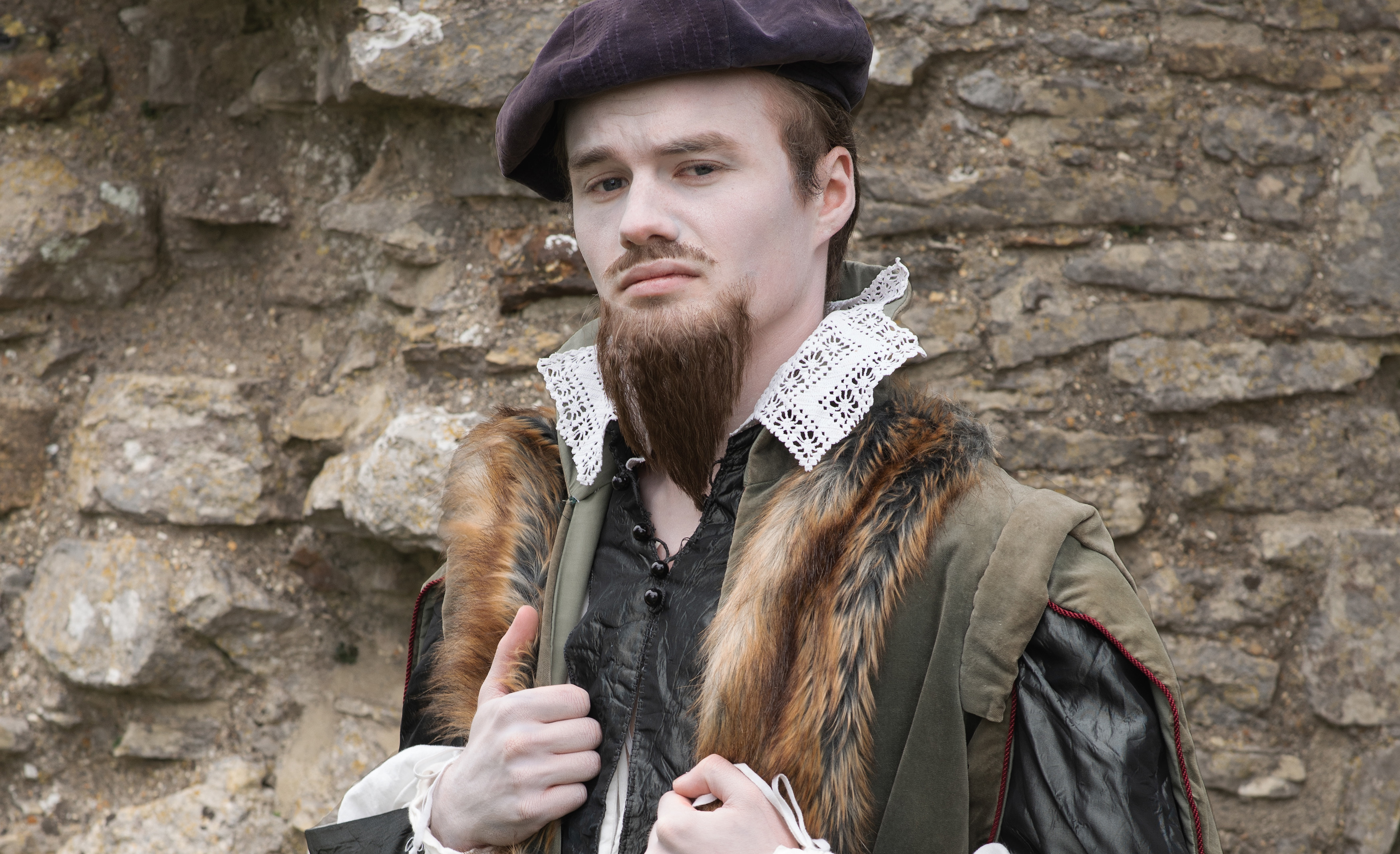 Actor playing Christopher Hutton, posing at Corfe Castle as part of a collaboration between AUB alumna and the National Trust