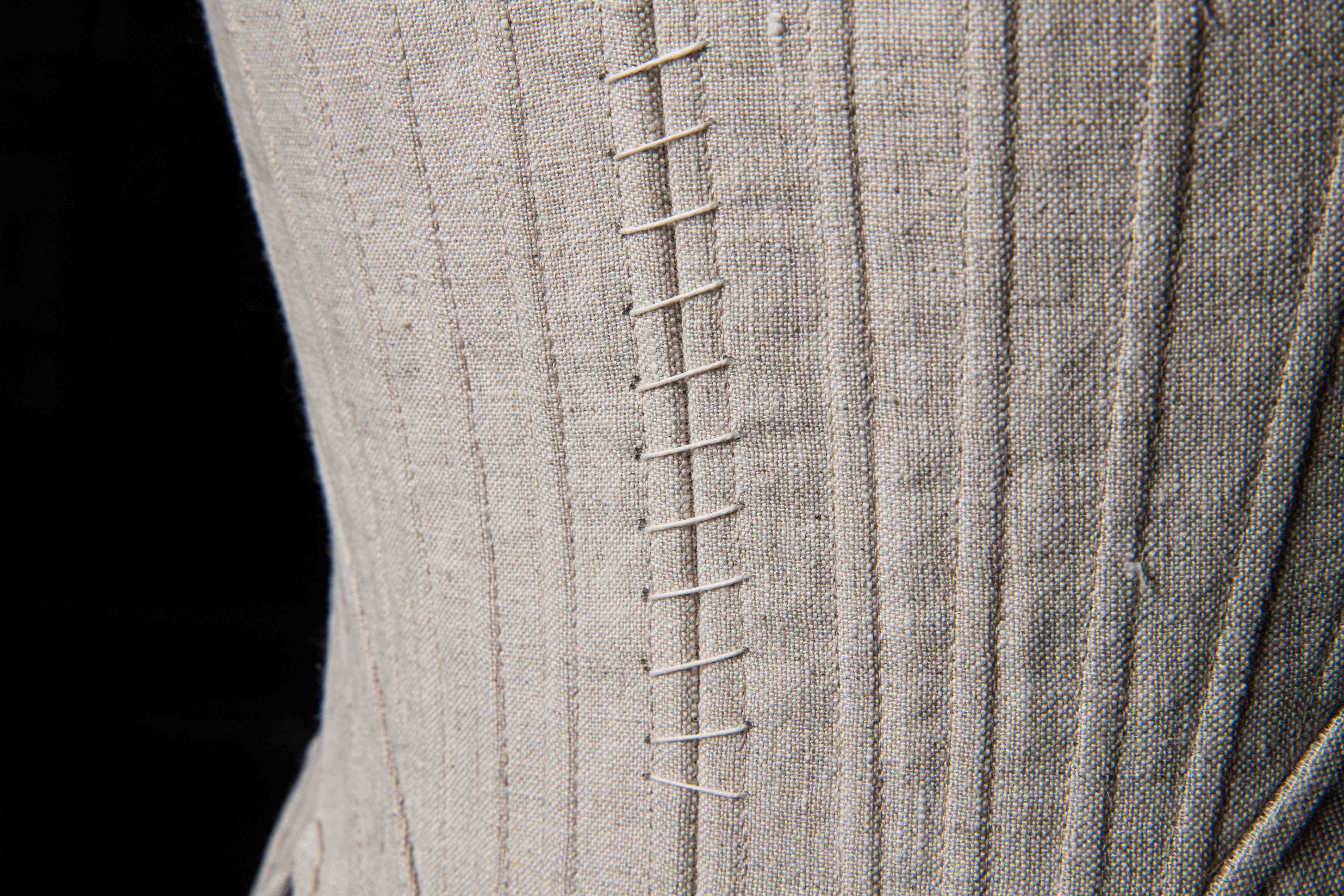 Close-up showing stitch work of a corset.