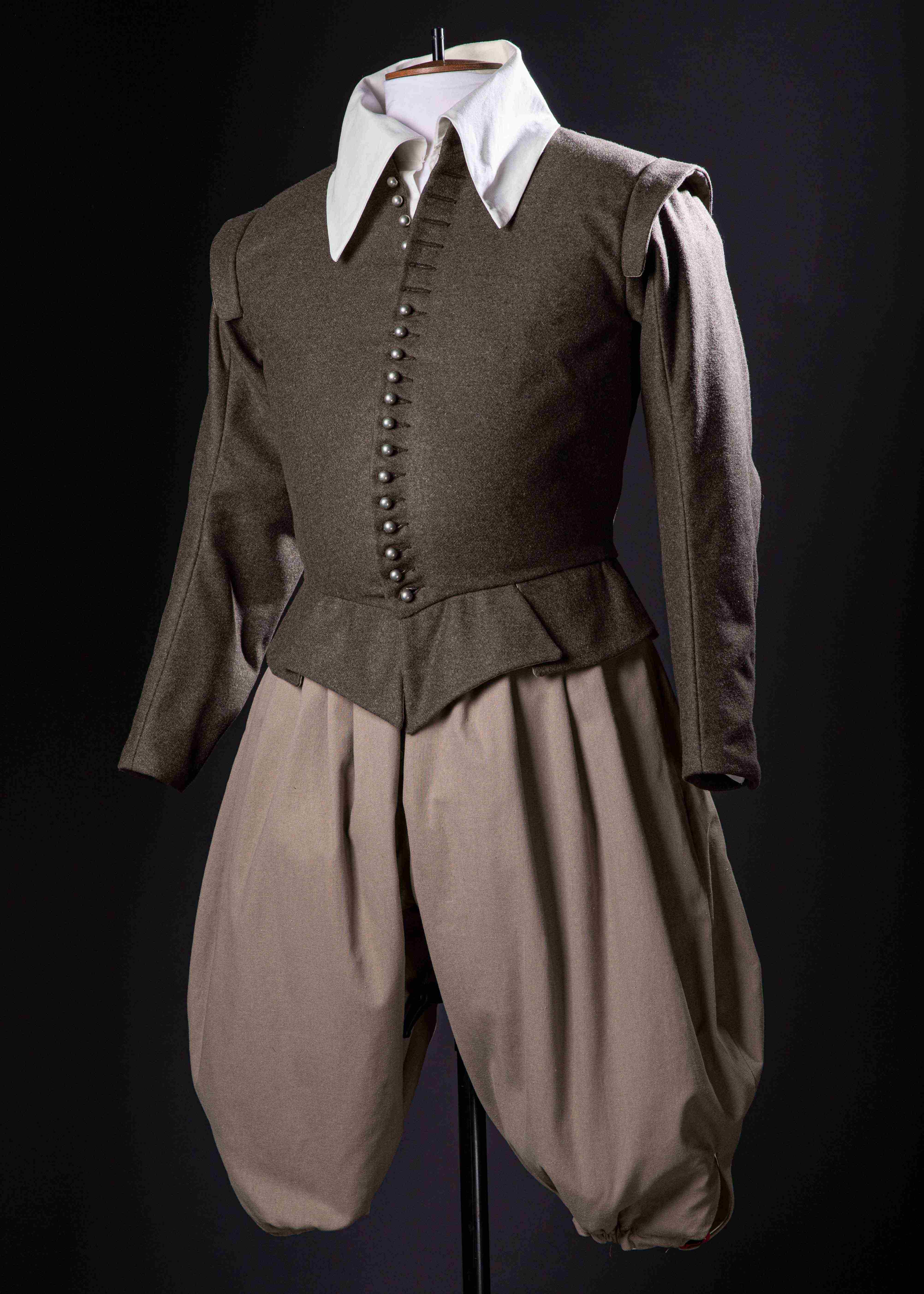 A historical-style doublet and breeches on a mannequin.