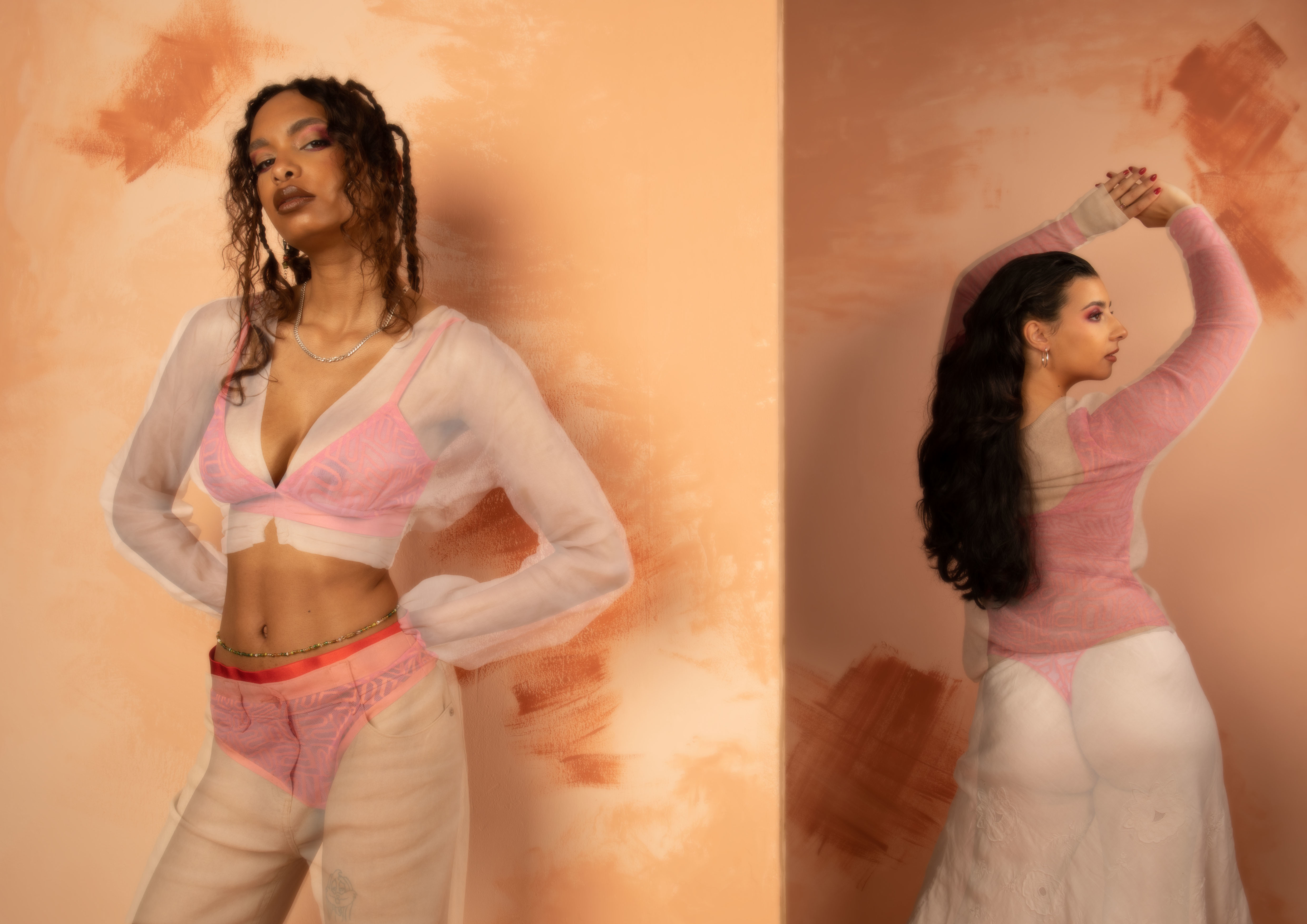 Two models, one posing while facing the front, the other with their back to the camera and their arms raised, both against an orange-brown backdrop.