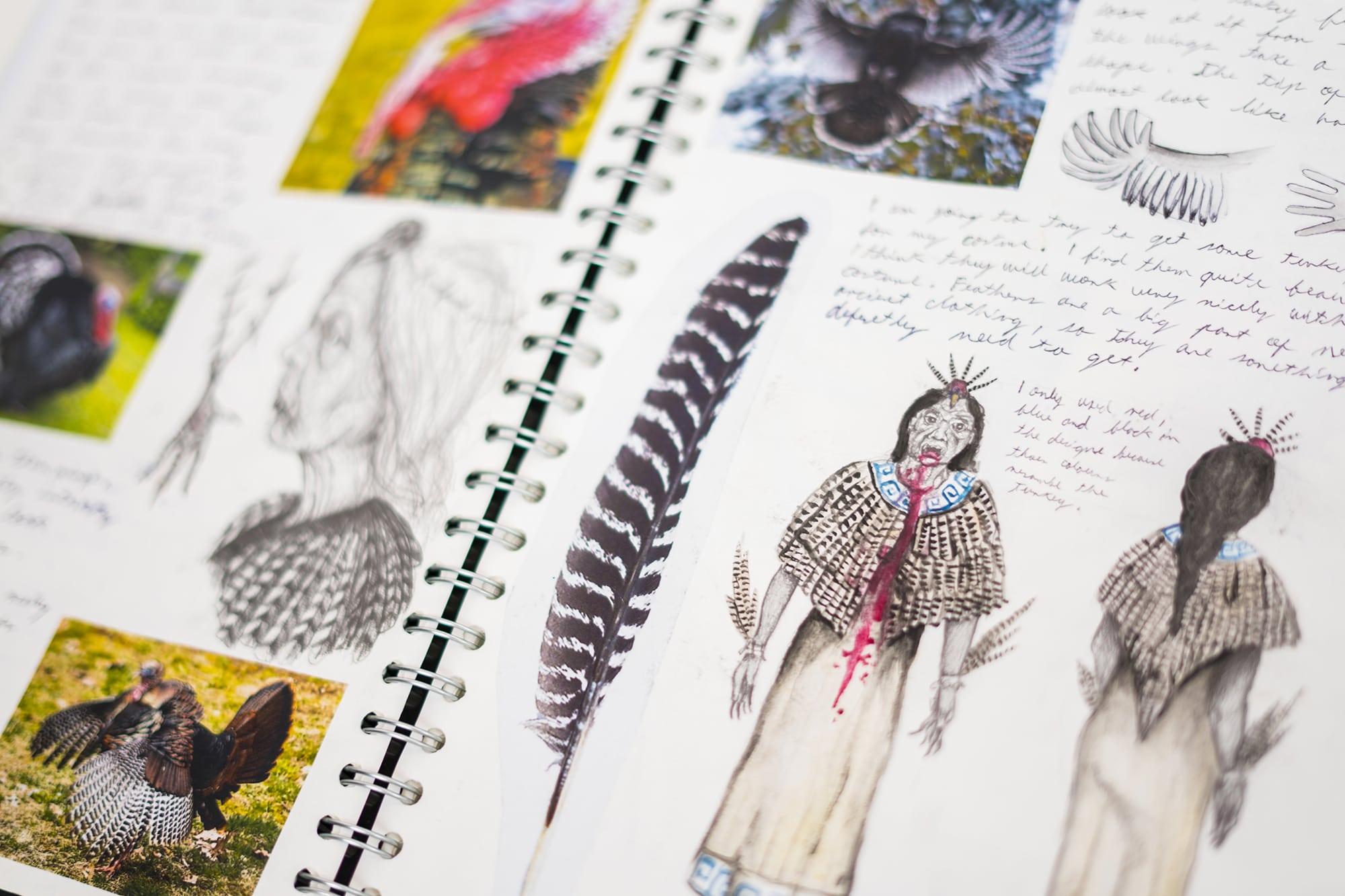 Sketchbook spread with feather