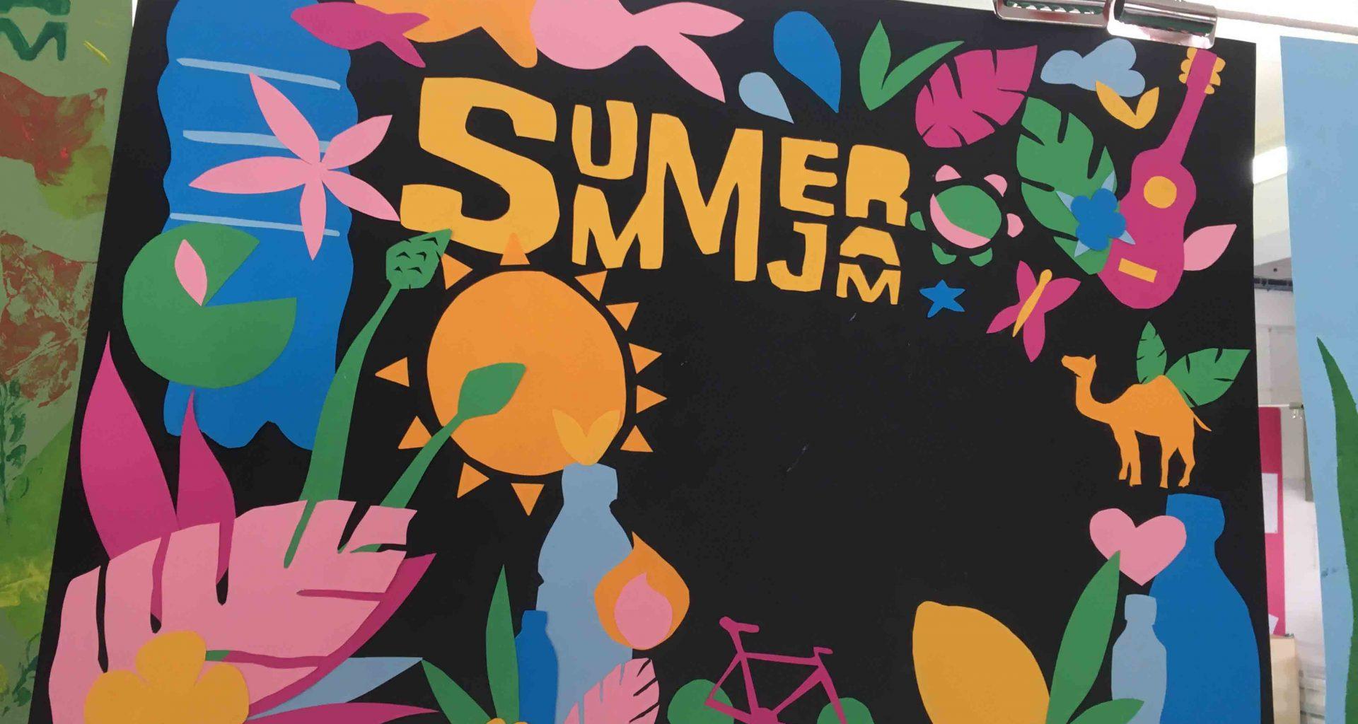Brightly coloured banner with cut-outs of plants, animals, bottles and the sun made of coloured paper. The words 'Summer Jam' appear towards the top.