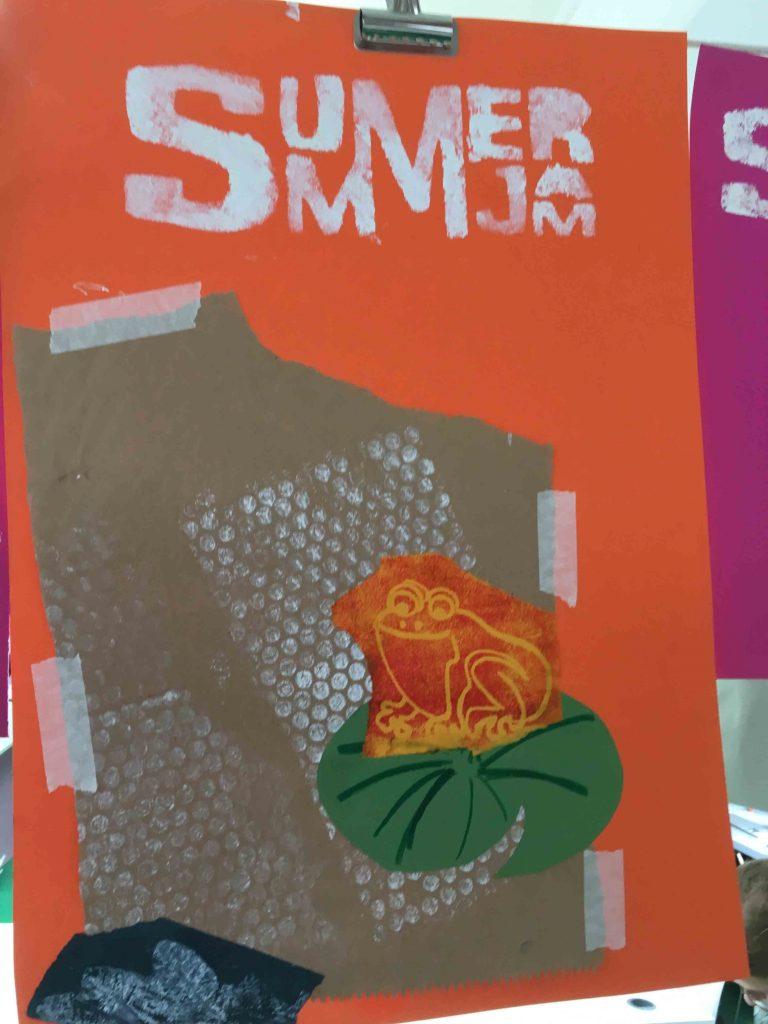 Piece of coloured paper with the words Summer Jam on the top and an image of a frog on a lily pad further down.