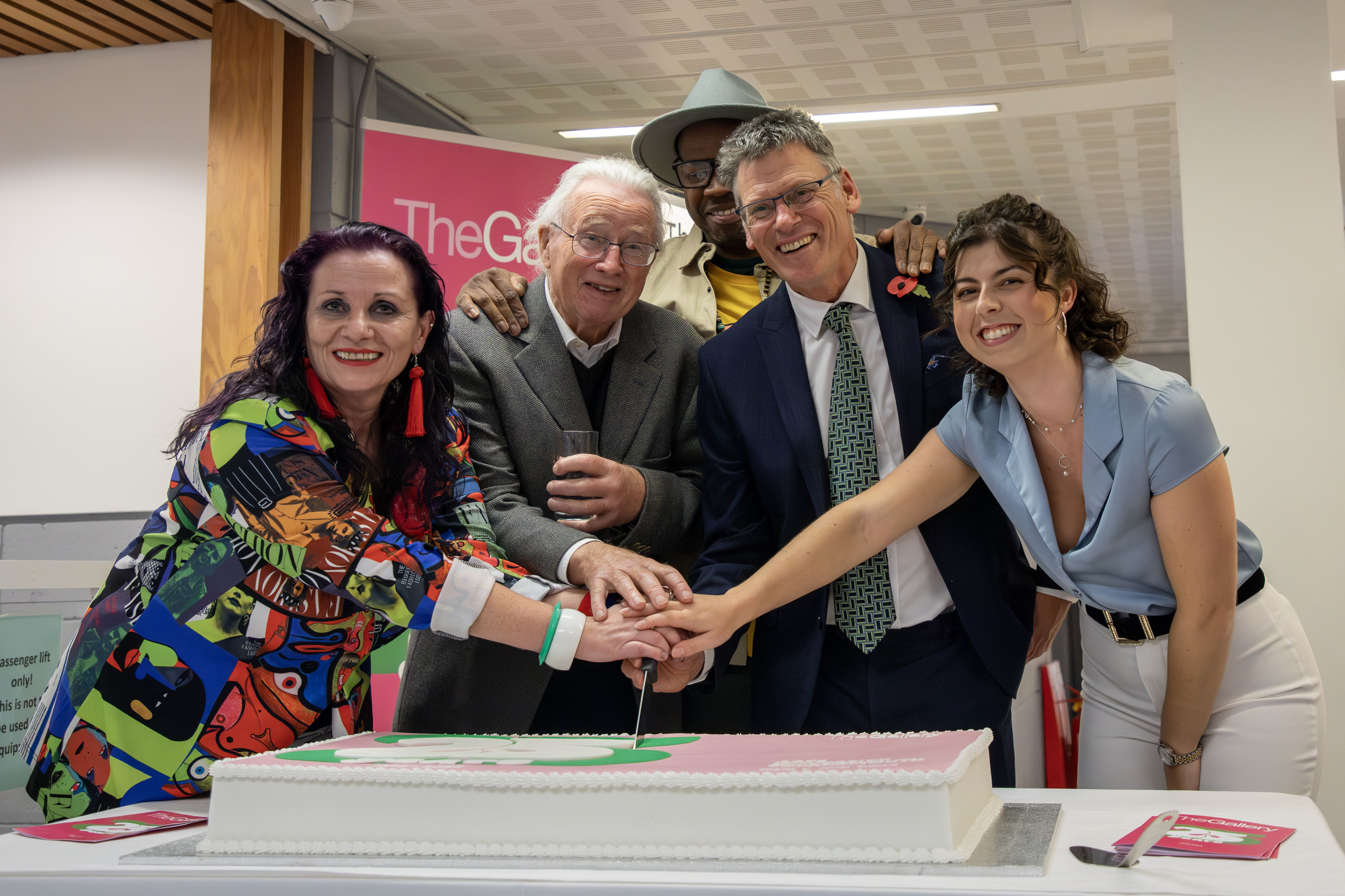 Professor Paul Gough, Violet McClean, Ian McKeever and TheGallery staff cut a cake commemorating TheGallery's 25th anniversary.
