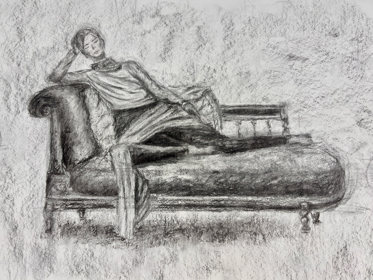 A charcoal sketch of a reclining person on a chaise longue, drawn on textured paper with loose shaded lines.