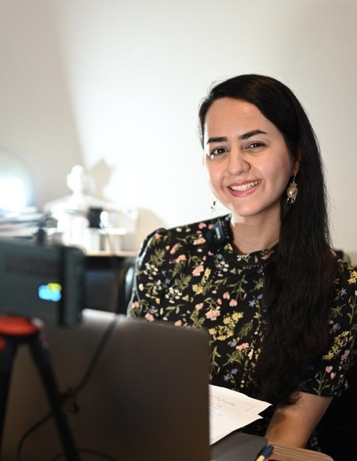 A headshot of Arezou Ramezani smiling