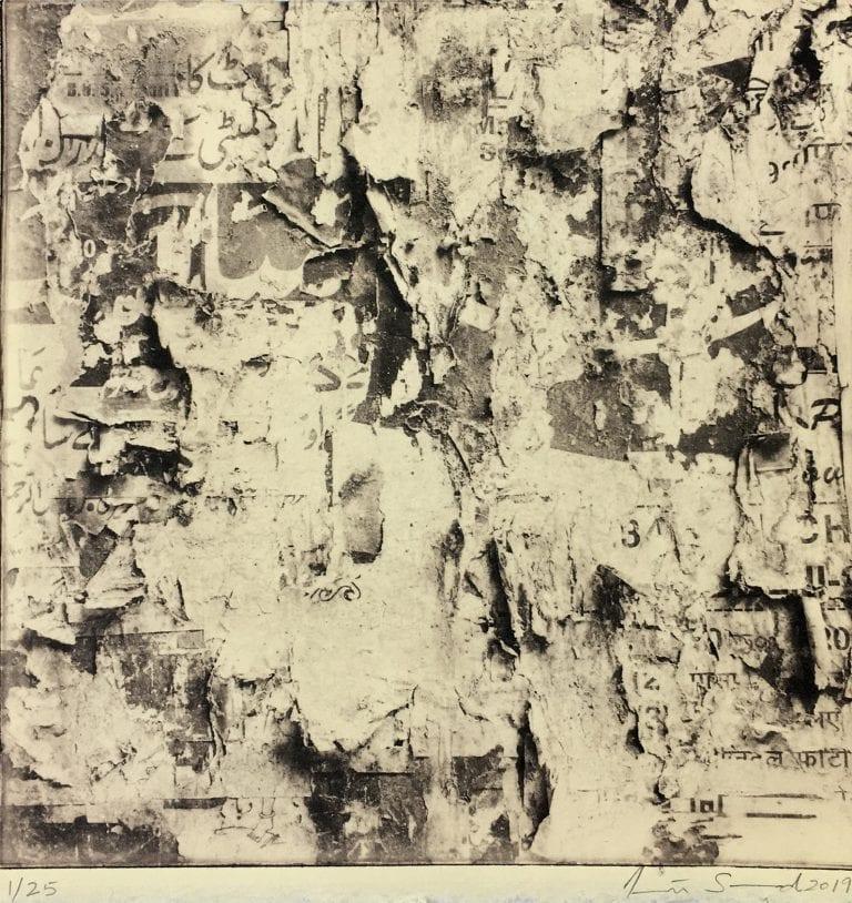 Black and white piece of artwork made up of distorted pieces of text and ripped paper.