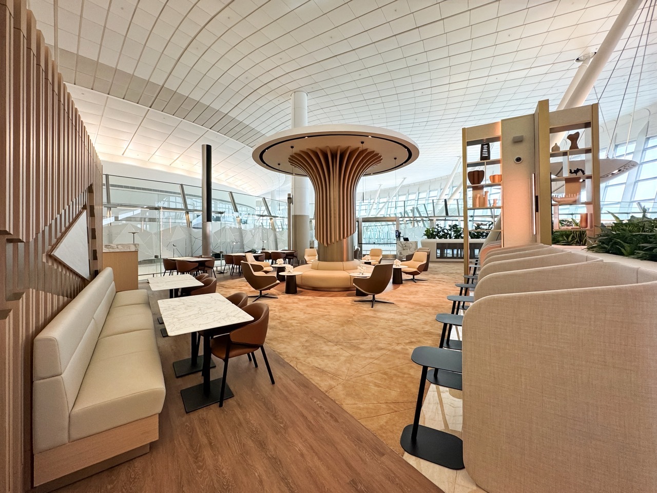 Etihad US Pre-clearance Lounge featuring wood accents and luxurious seating.
