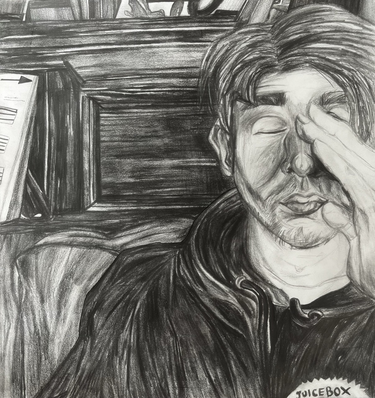 Pencil sketch of a man with closed eyes.