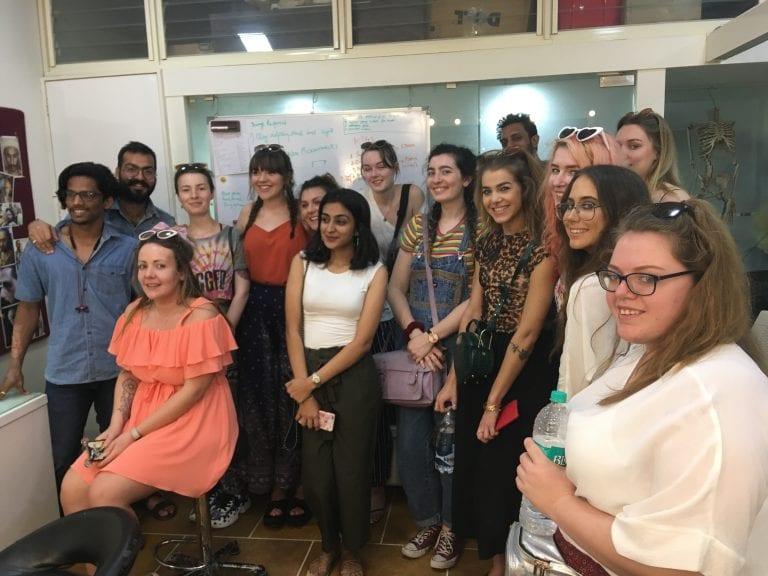 A group of Make-Up for Media and Performance students gather and pose for a photo.