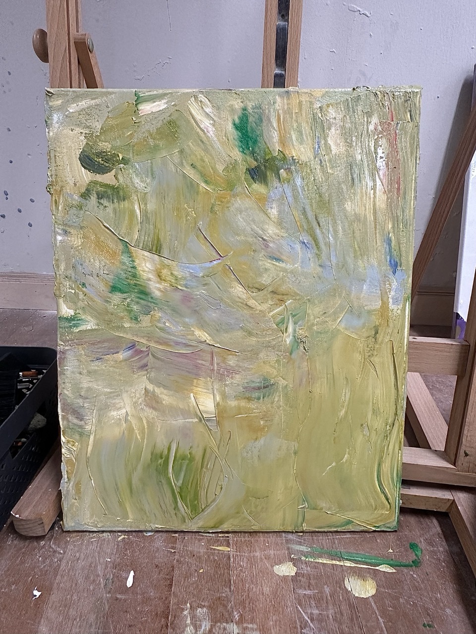 Abstract light green painting on a canvas.