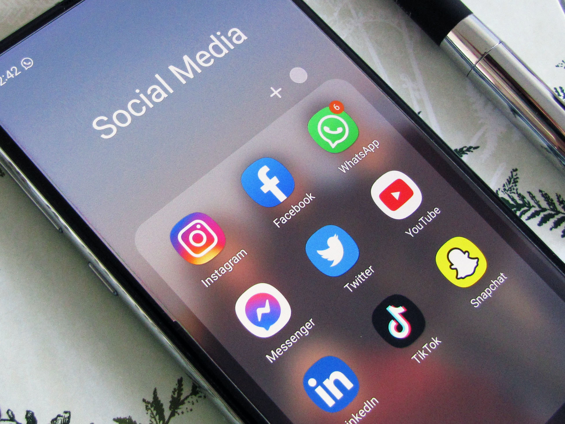 phone with social media icons on it