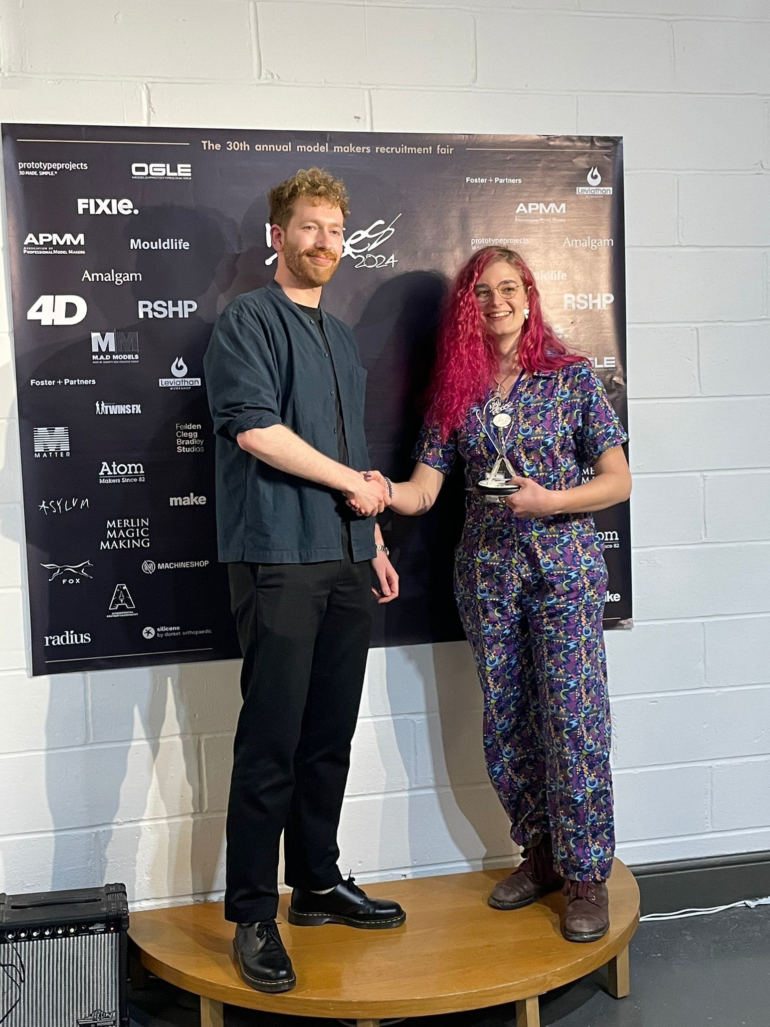 BA (Hons) Modelmaking student I. Hughes poses for a photo with their award at New Blades 2024.