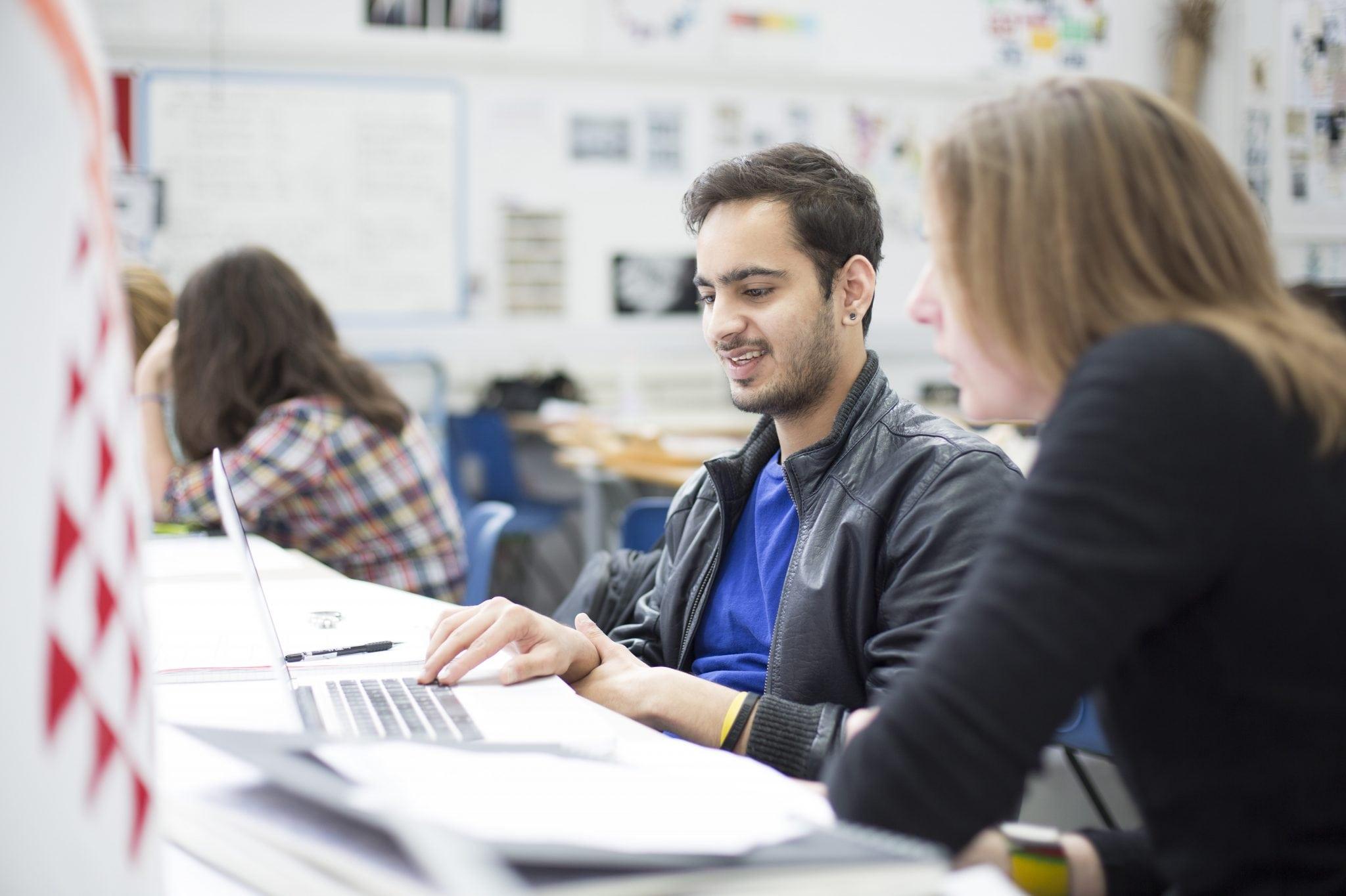 International Student, Sid Mehdiratta, working on a computer