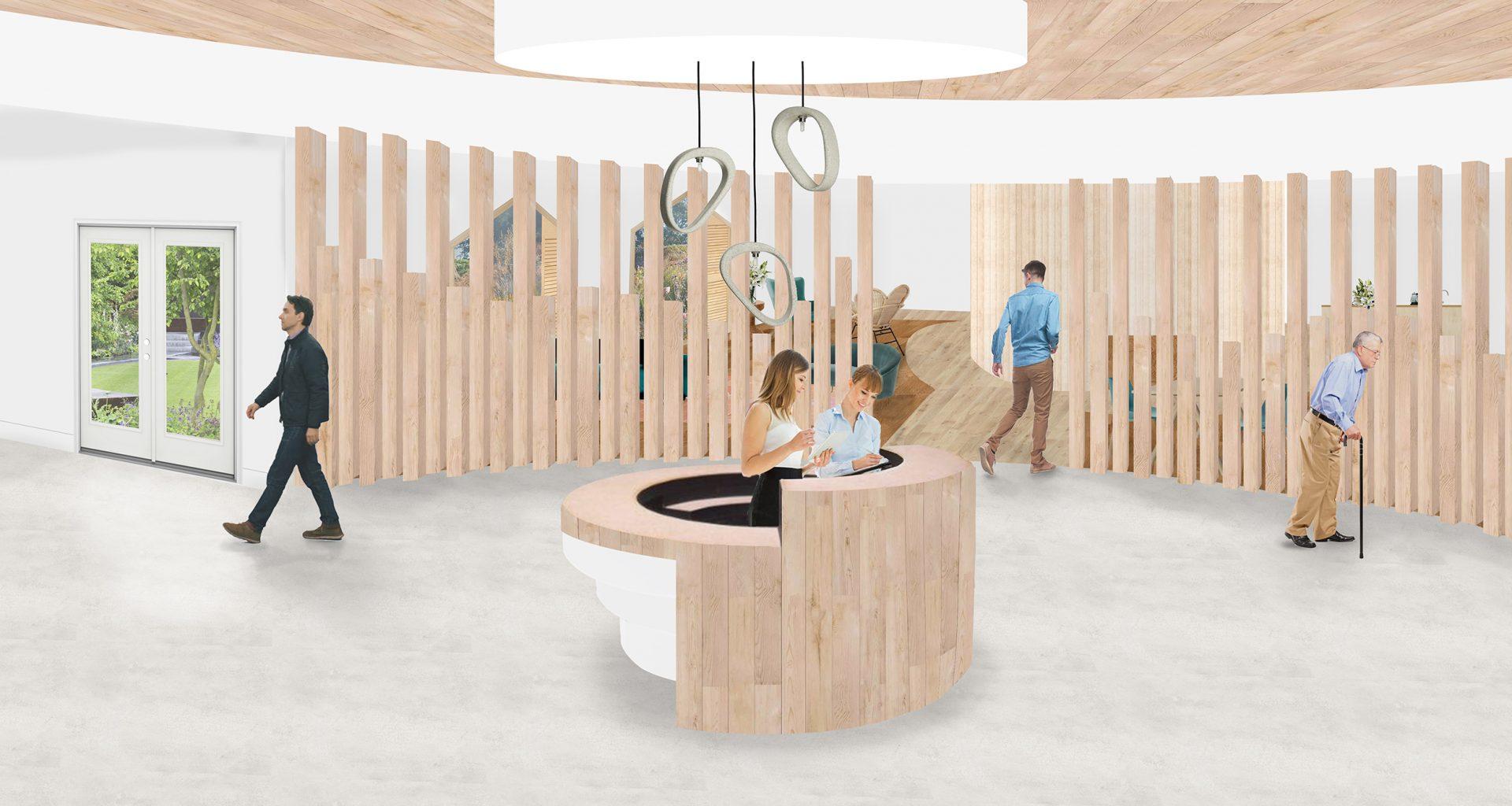 People walk around a well-lit round reception area. Two people work at a circular desk in the middle of the room.