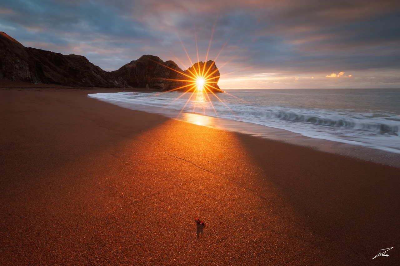An early morning 'sunstar' at Durdle Door.