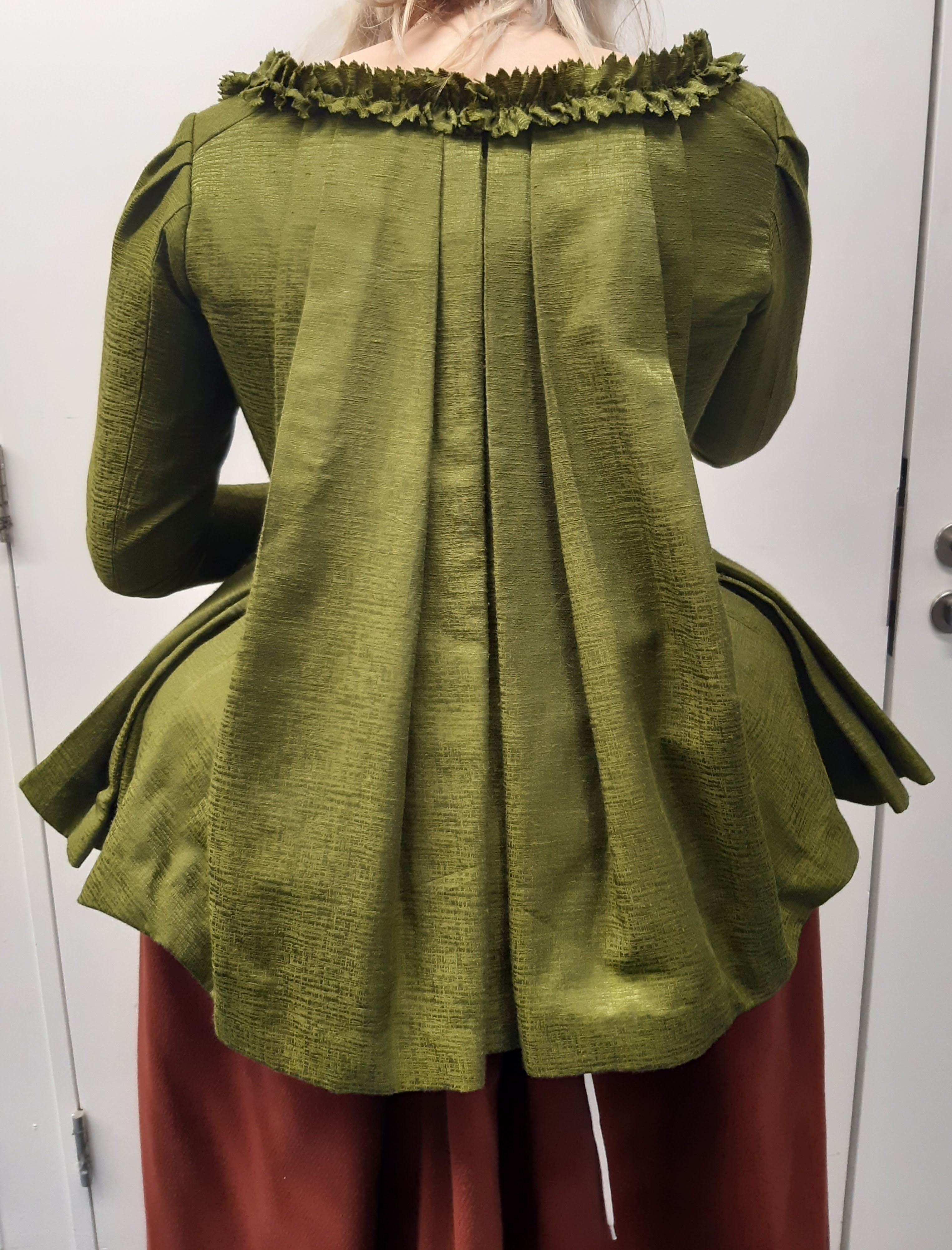 A French Revolution peasant costume (jacket and skirt) viewed from the back, designed by a BA (Hons) Costume student.