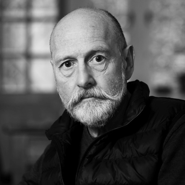 Black and white headshot for J McMillan.