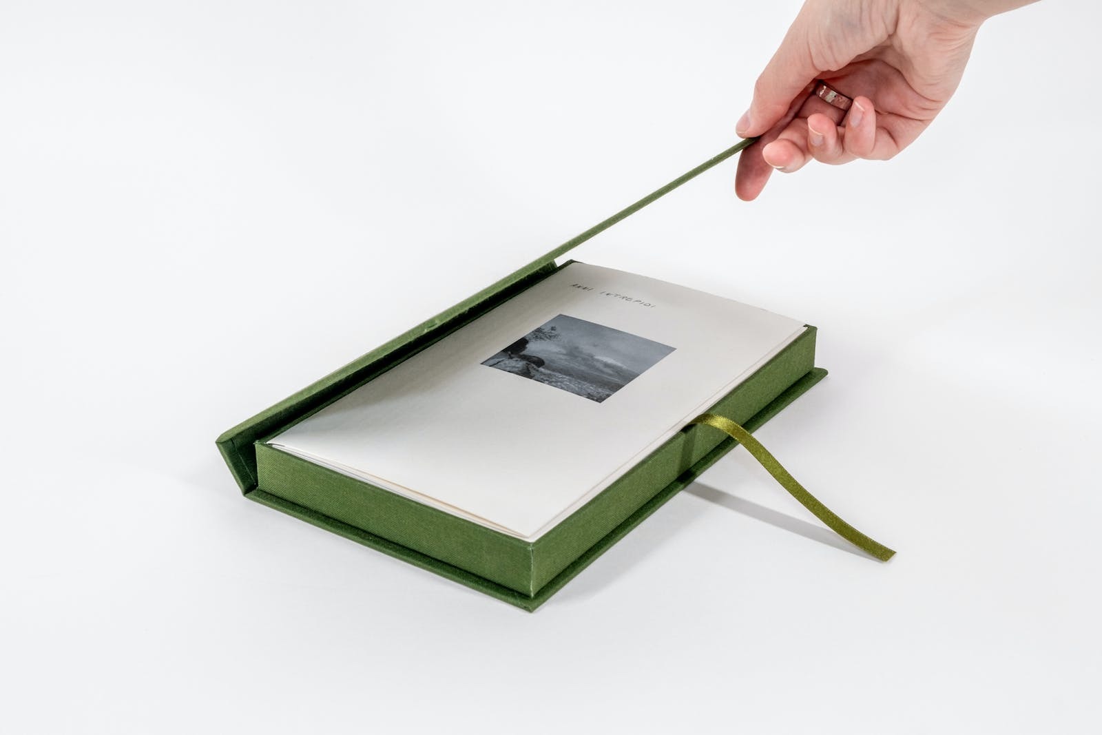 A book being opened by a hand