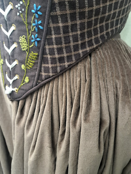 This is a close-up of the cartridge pleating technique, common through much of history, used to make the period accurate skirt.