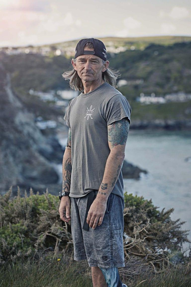 Man standing by a cliff