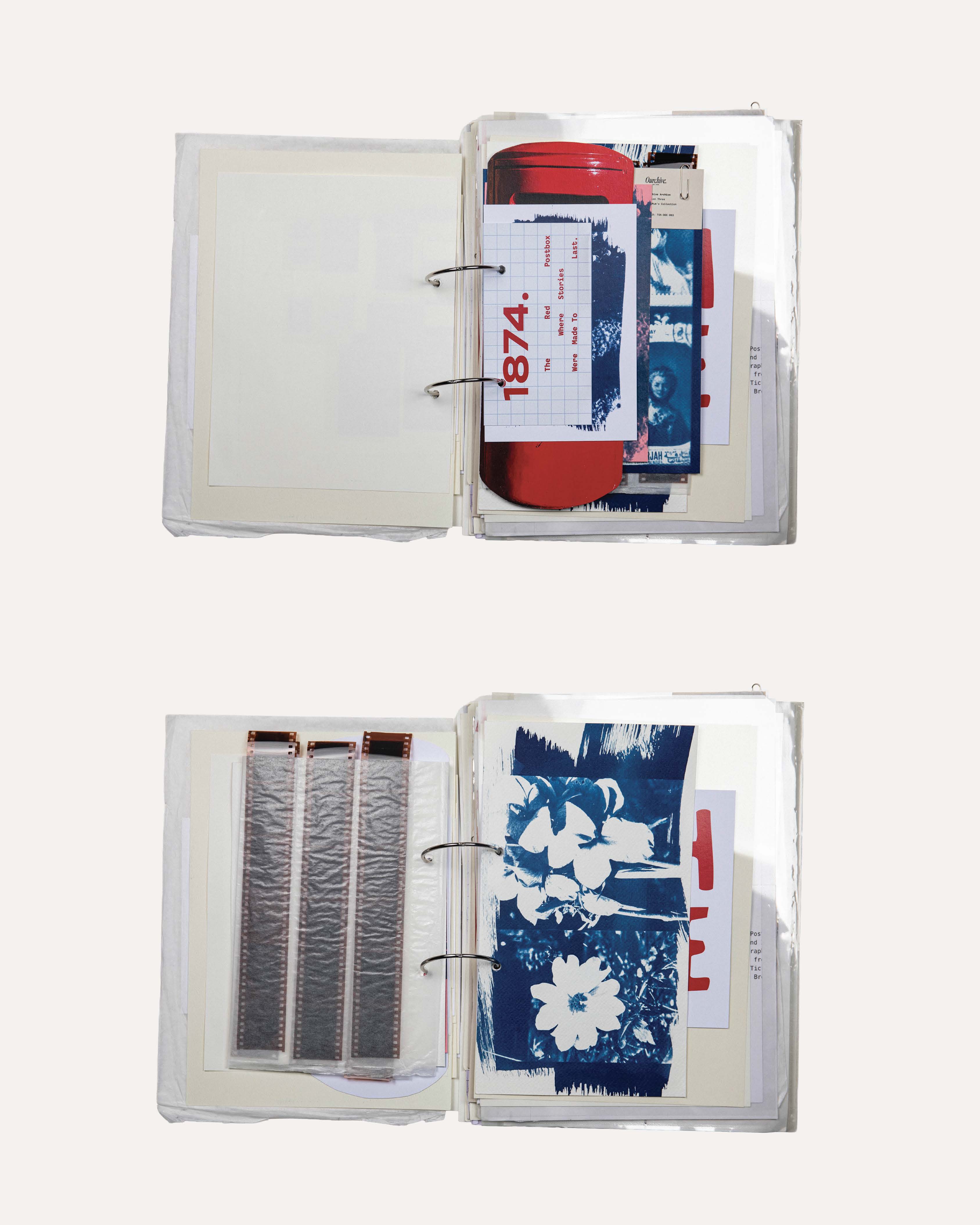 An open binder displaying a collection of various items, including printed cards and photographs, arranged on cream-coloured pages. The items include a red container and colourful images featuring floral patterns and other designs.