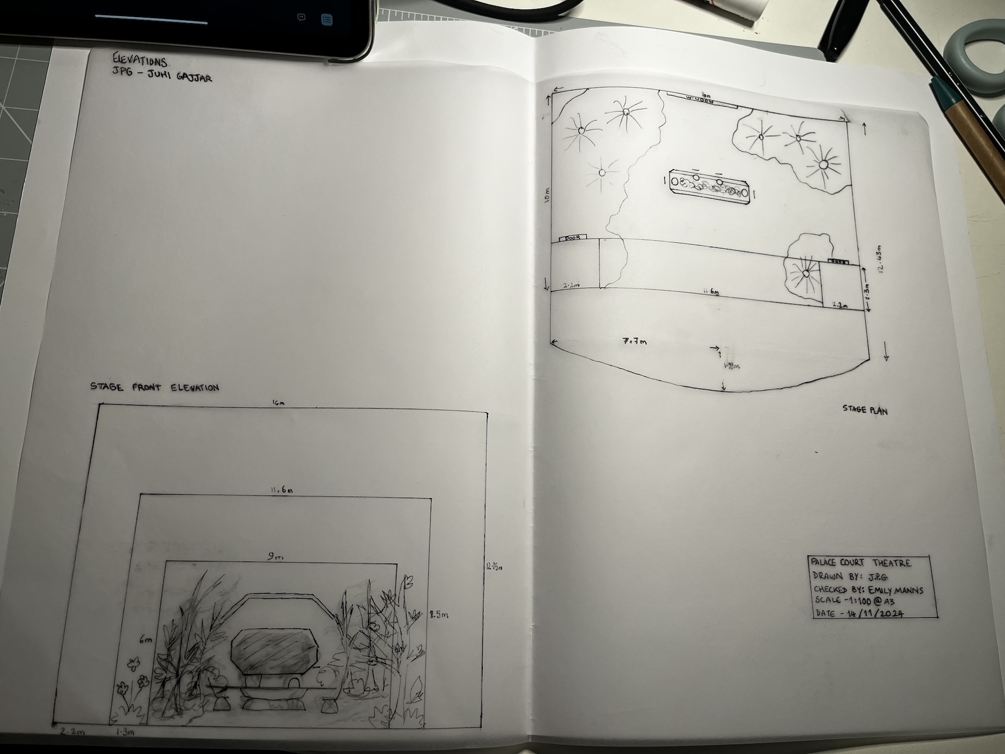Open sketchbook showing two pencil drawings: left page has rectangular frame with fish tank scene, right page shows geometric floor plan layout.