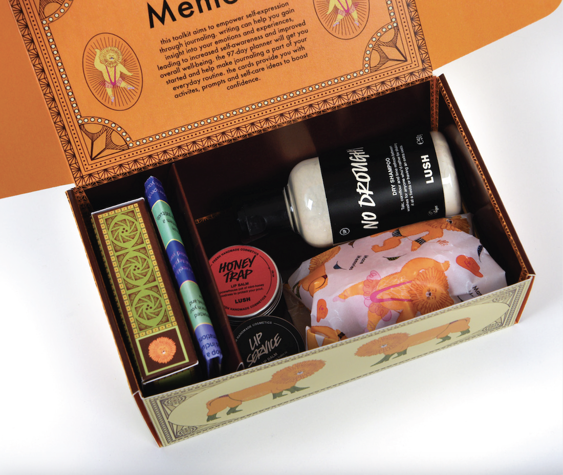 Inside a packaging design for Lush, showing a deck of cards, plus various Lush products.