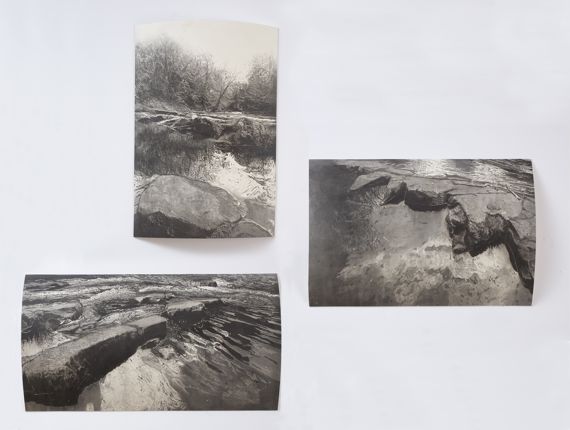 A series of three drawings of water cascading down rocks.
