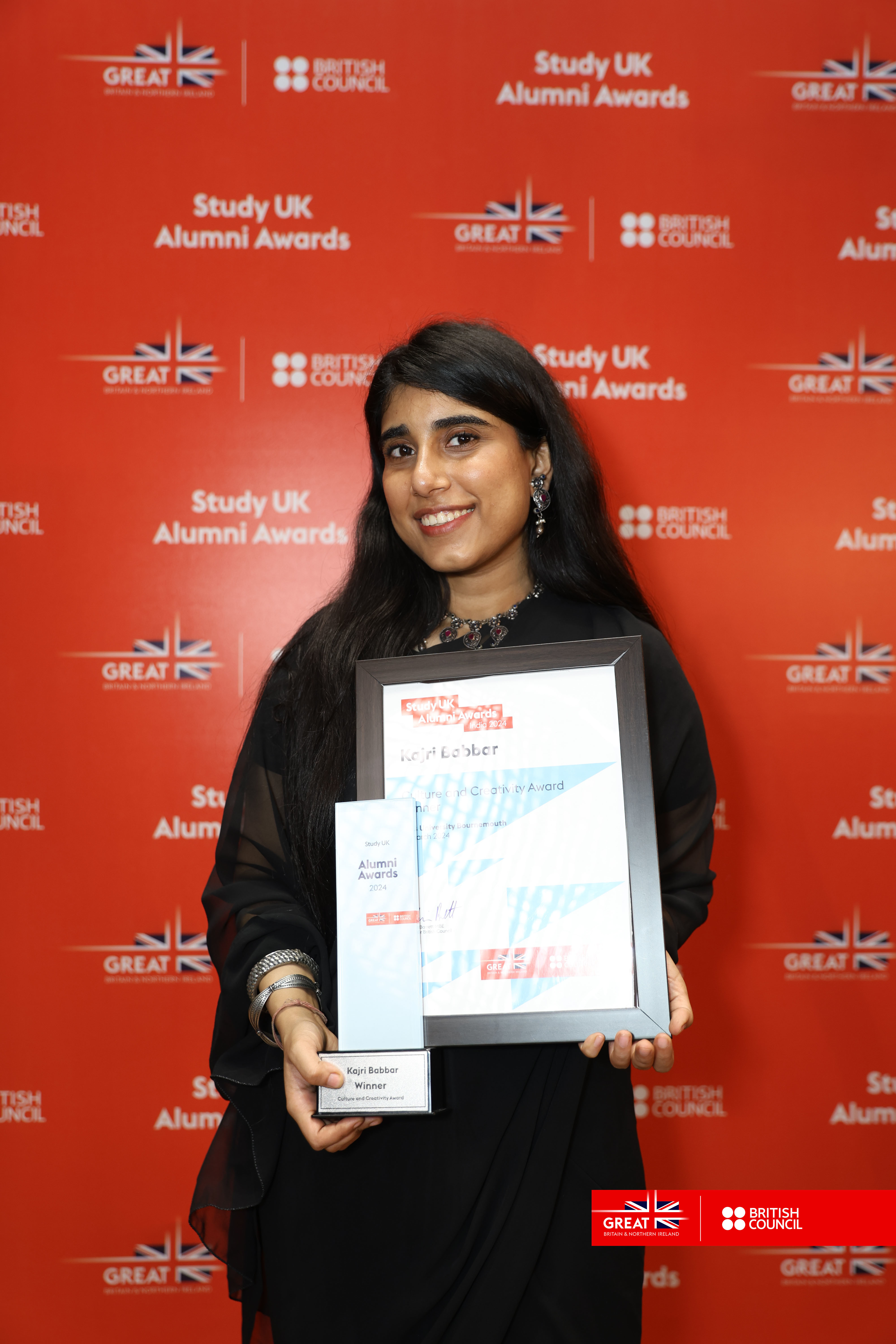 K Babbar poses for a photo with her awards at the British Council Study UK Alumni Awards.