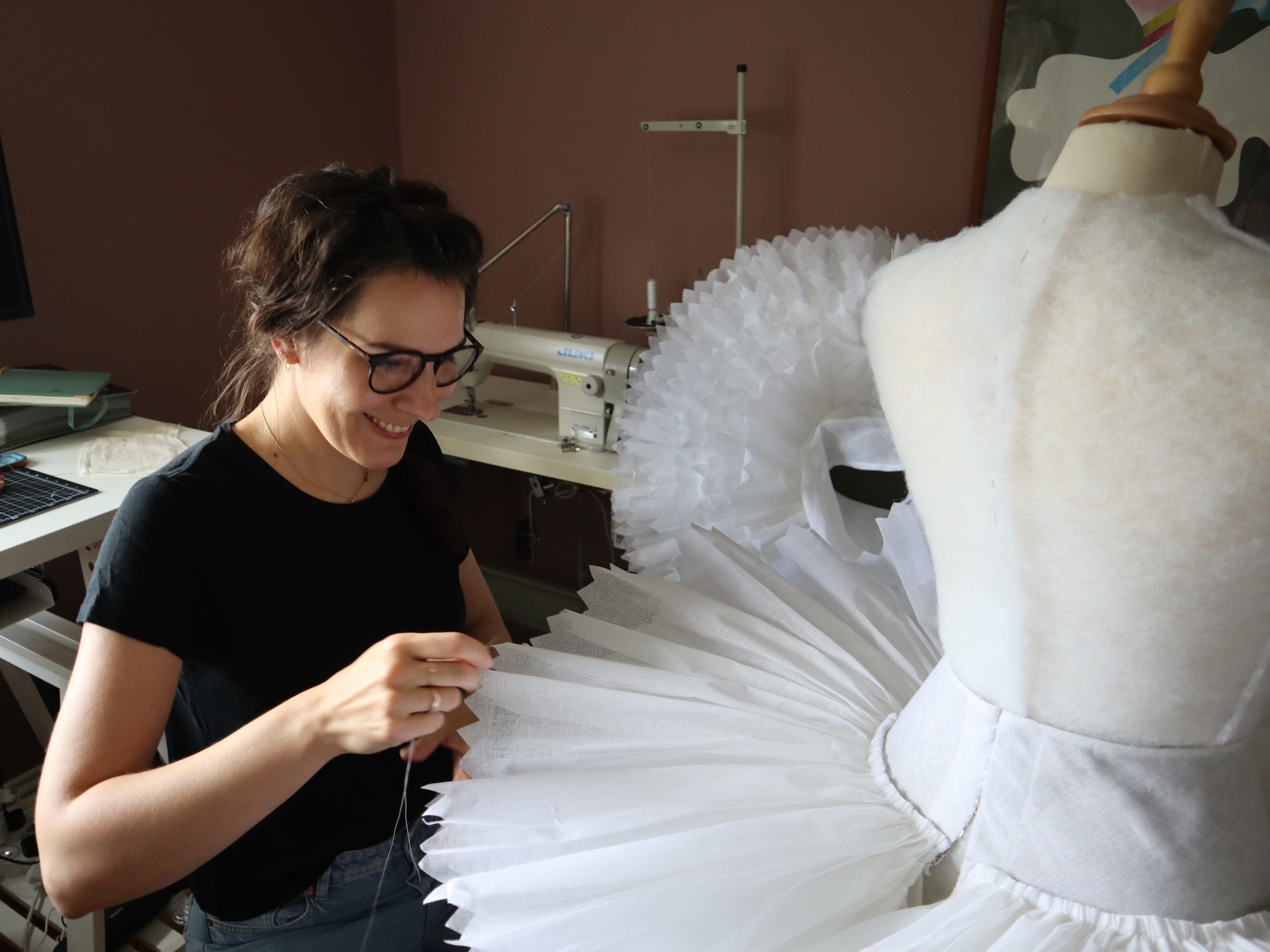 MRes Arts graduate K Kincel works on a tutu.