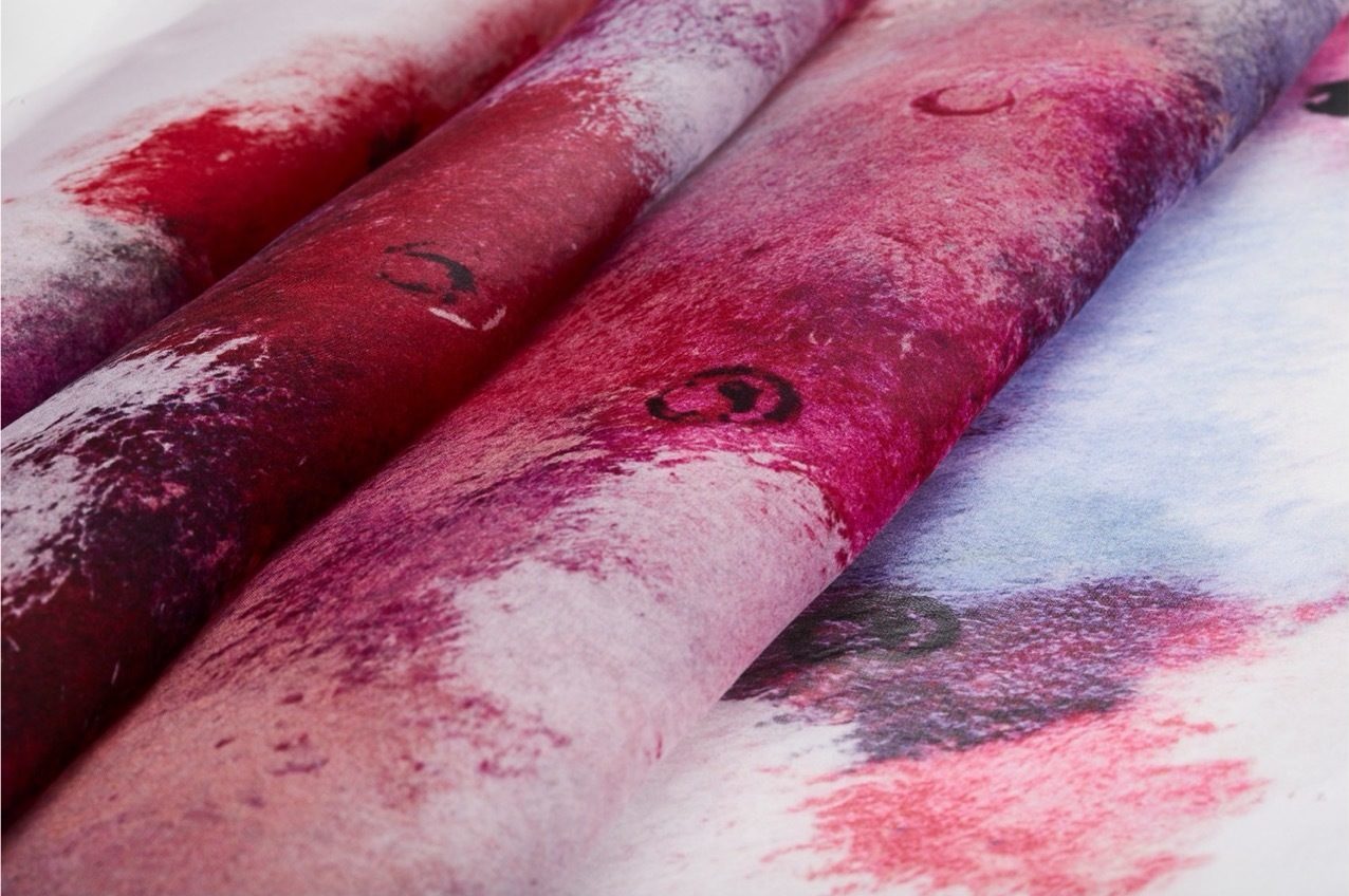 Close-up of pink-patterned layered fabrics.