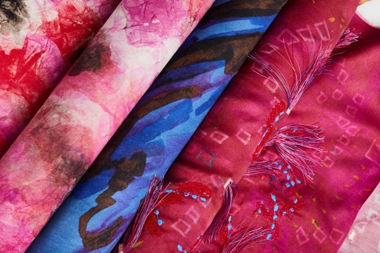 Close-up of pink and blue-patterned layered fabrics.
