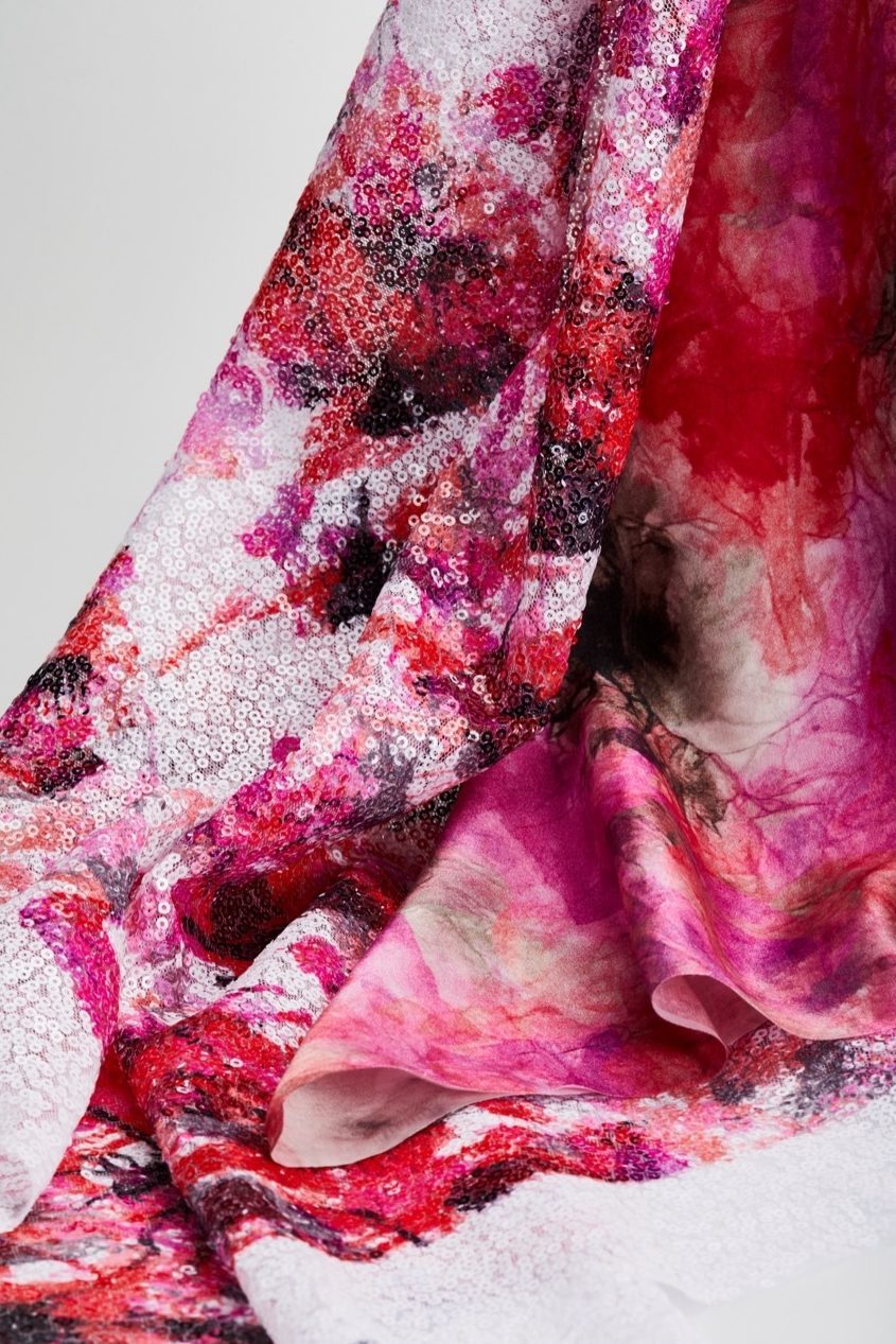 Pink and red-patterned fabrics on a white background.