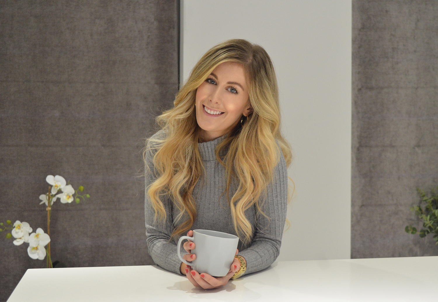 Image of Katie Thomas holding coffee mug