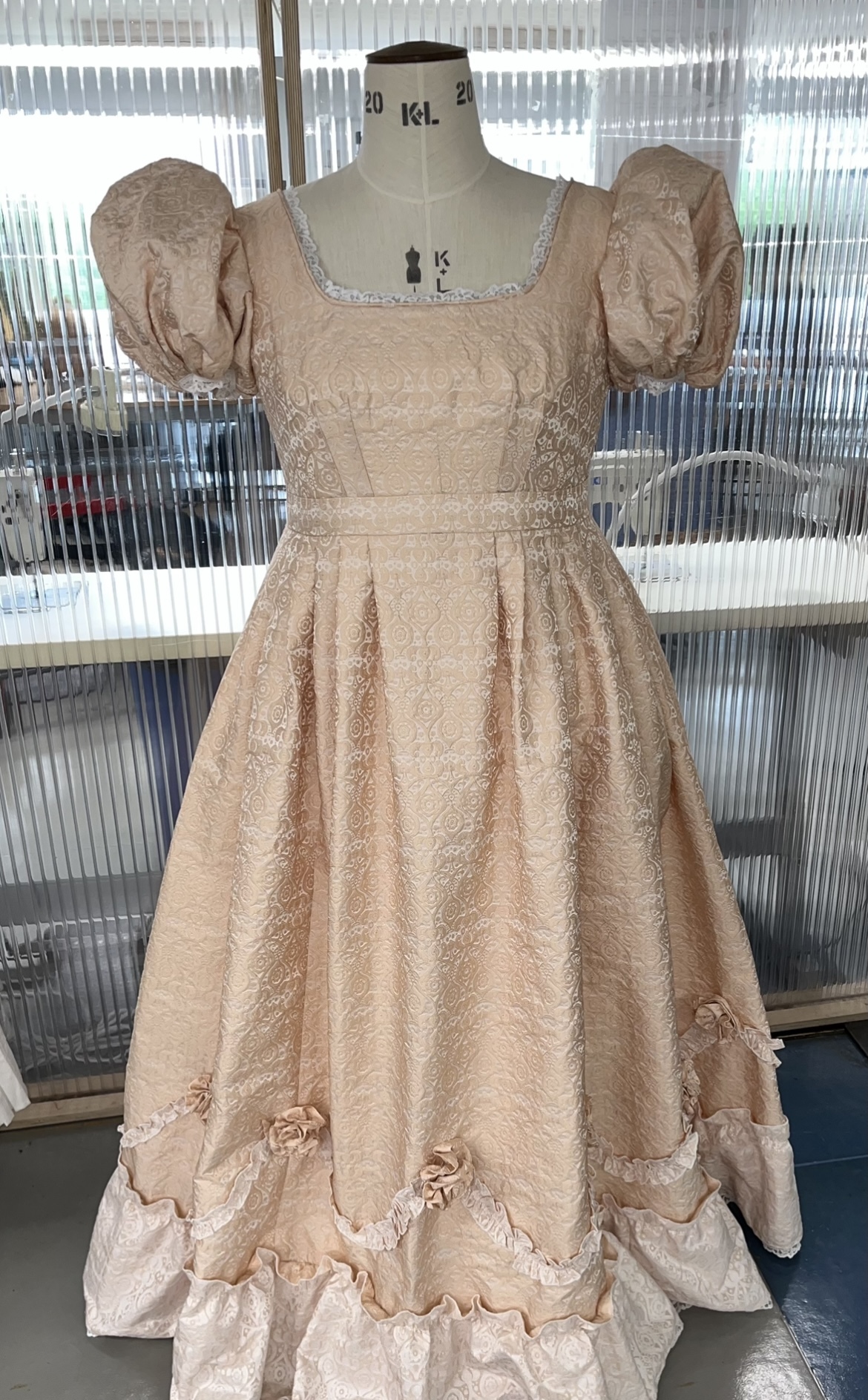 Major Project replica costume of an 1824 regency dress from Blandford Museum archive, made with patterned silk fabric, completed with undergarments of a corset, petticoat and chemise.
