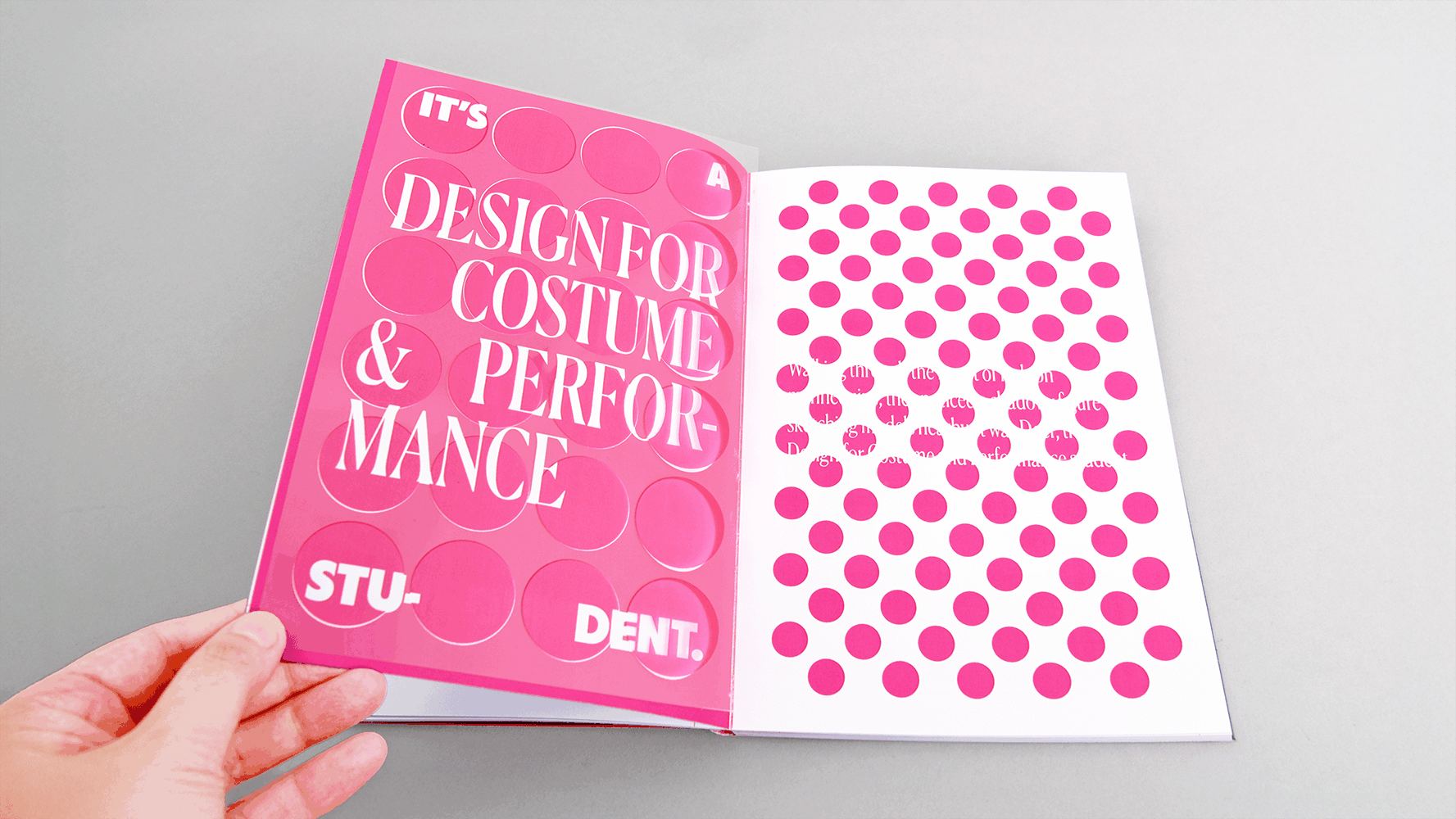 Open brochure with bright pink left page containing white text, right page features pink polka dots on white background.