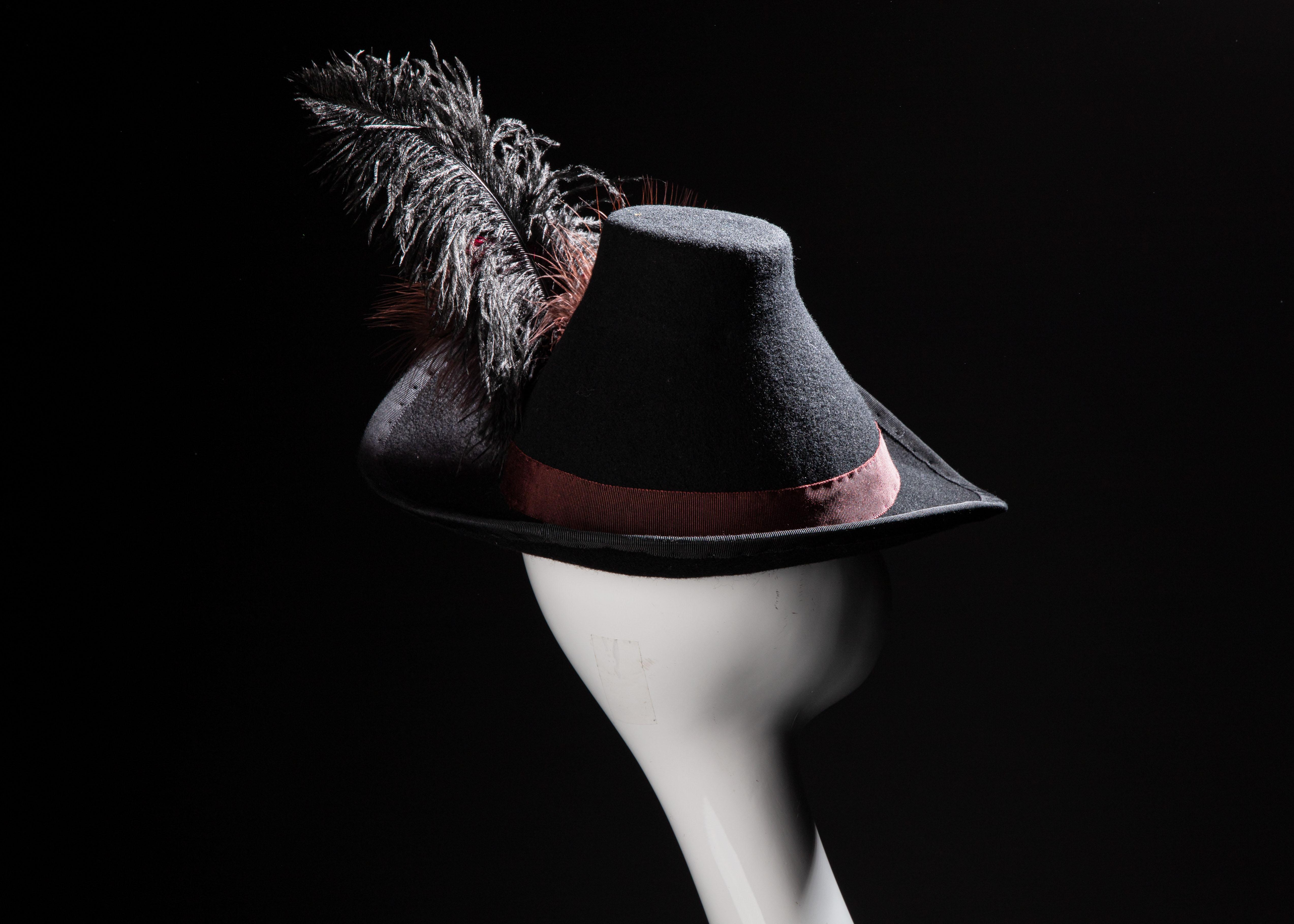 A costume hat with a feather