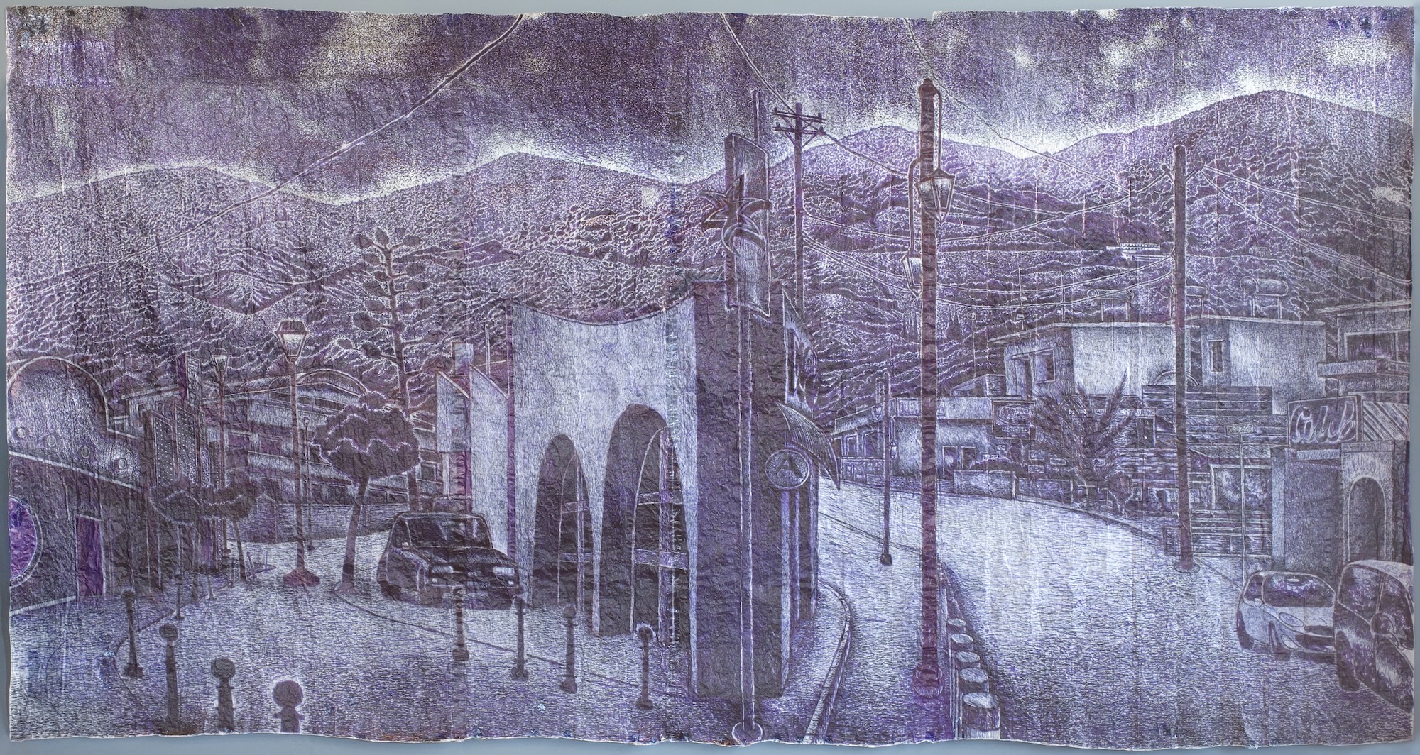 A purple-toned mural shows a curving road with cars, streetlights and utility poles, set beneath layered hills and buildings.