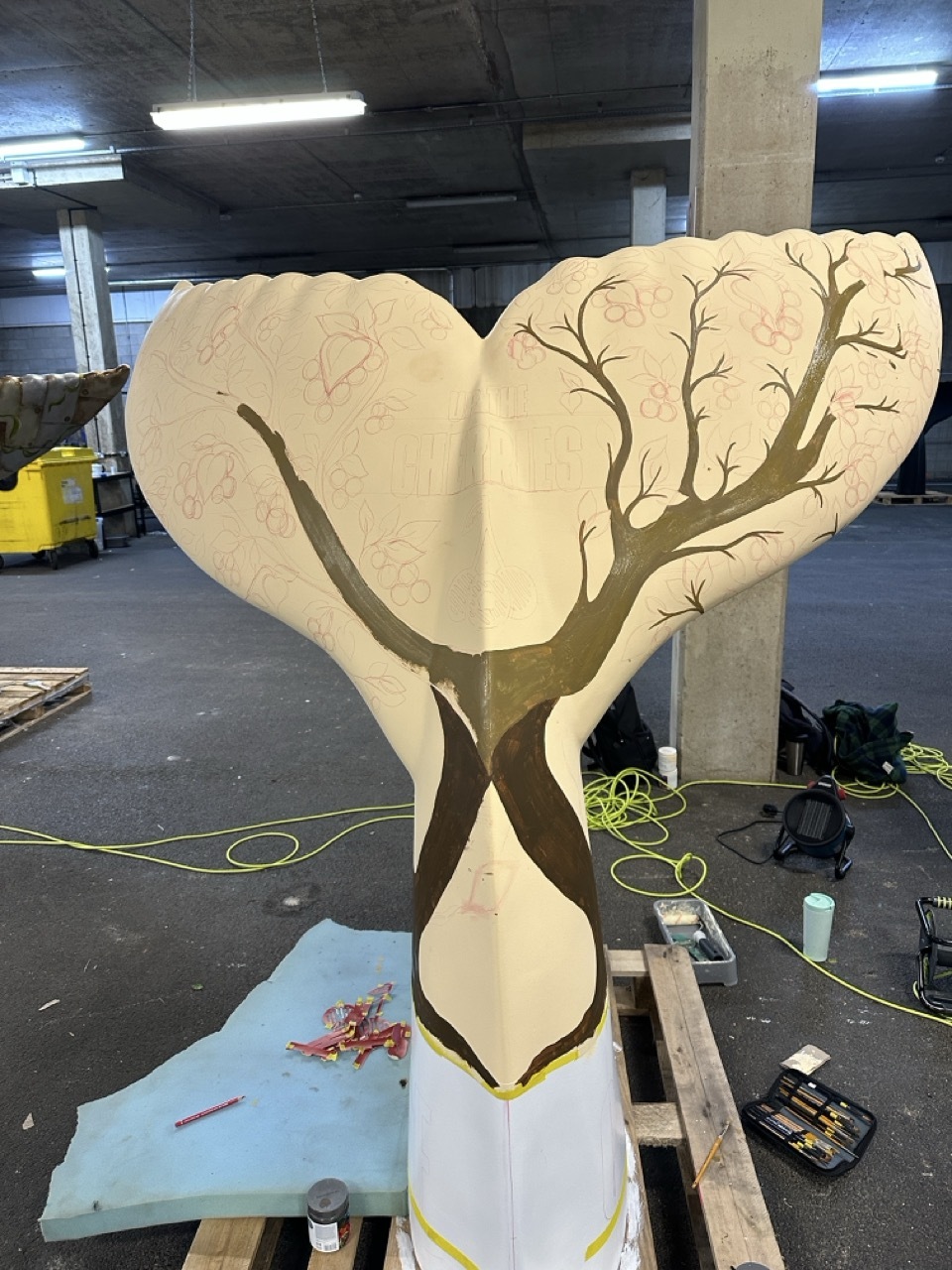 Early stages of L'Eisha's tail showing cream background and branches being painted on.