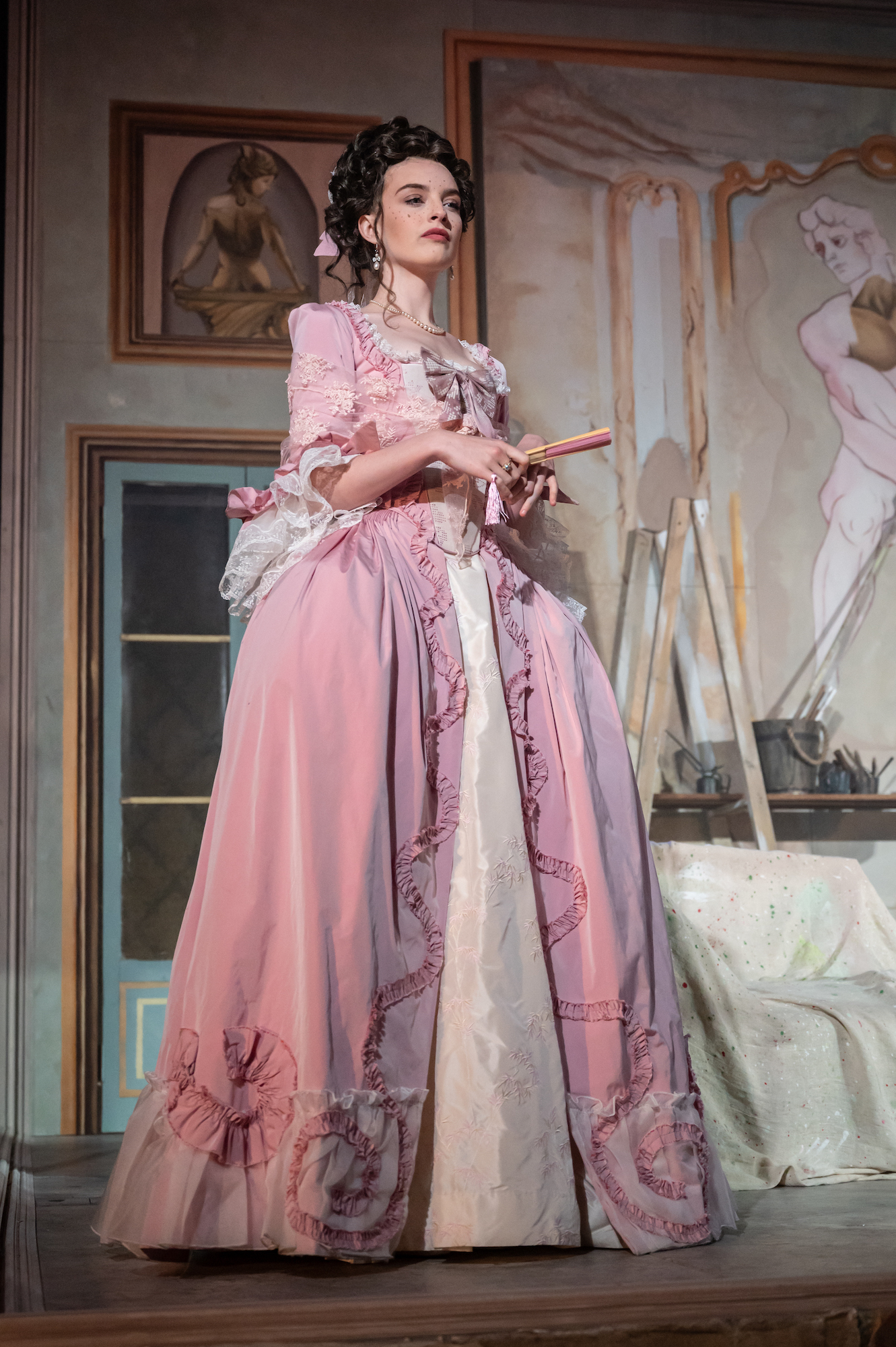 A BA (Hons) Acting student wearing an 18th century-style dress while performing La Casa Nova at Palace Court Theatre.