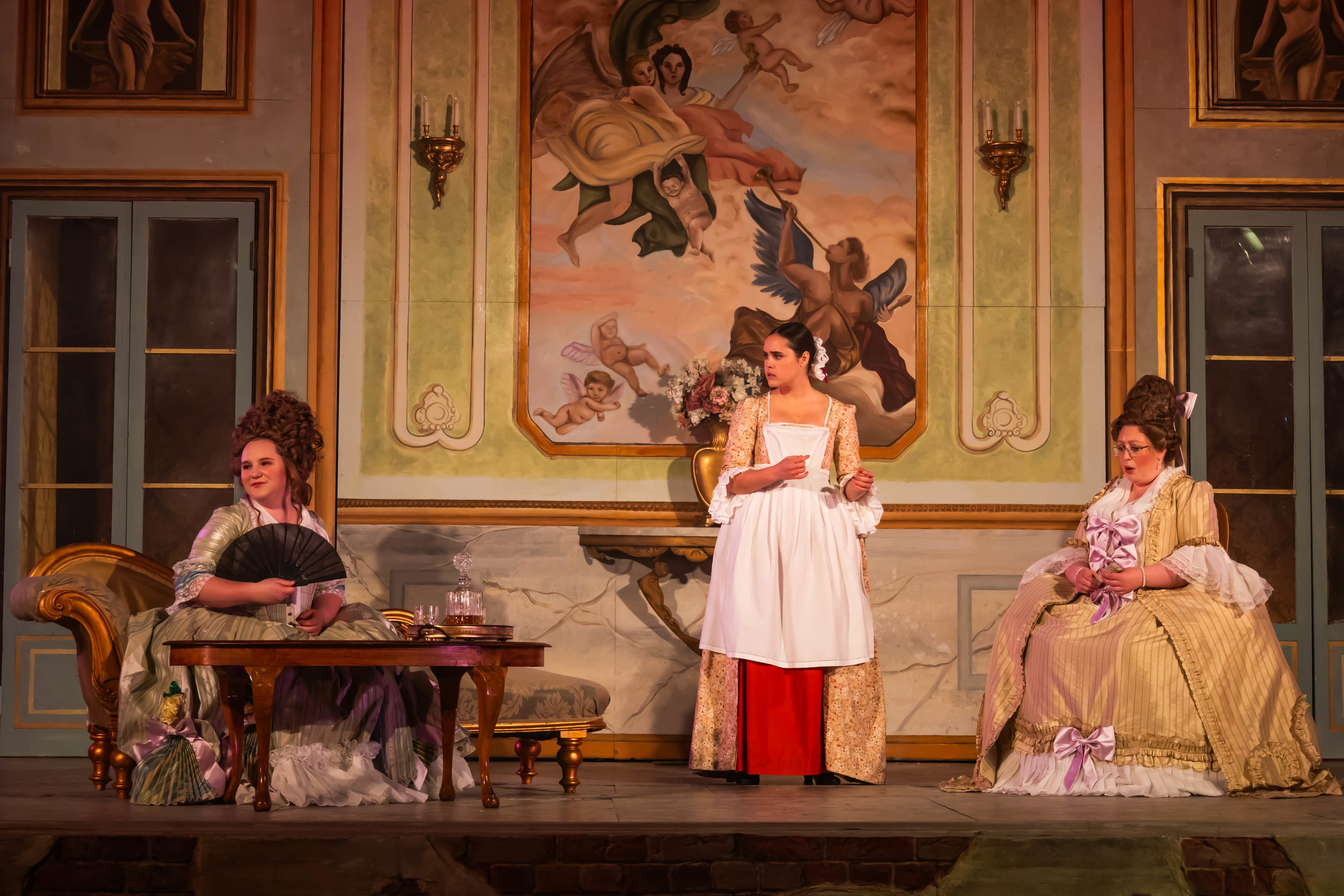 Three BA (Hons) Acting students in period costume performing a scene from La Casa Nova at Palace Court Theatre.