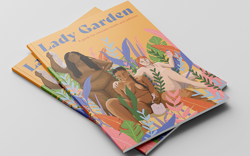 Two copies of a magazine depicting nude women sitting around plant life. The words 'Lady Garden' appear along the top.