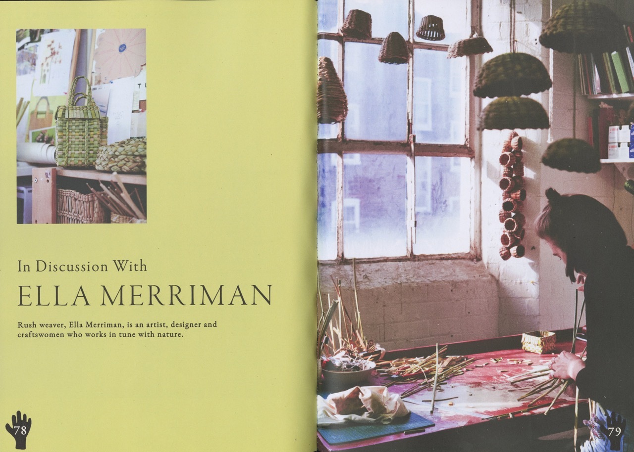 Magazine spread with yellow left page featuring "In Discussion With ELLA MERRIMAN" text and small images. Right page shows interior with large window, hanging dark objects, and colourful rug.