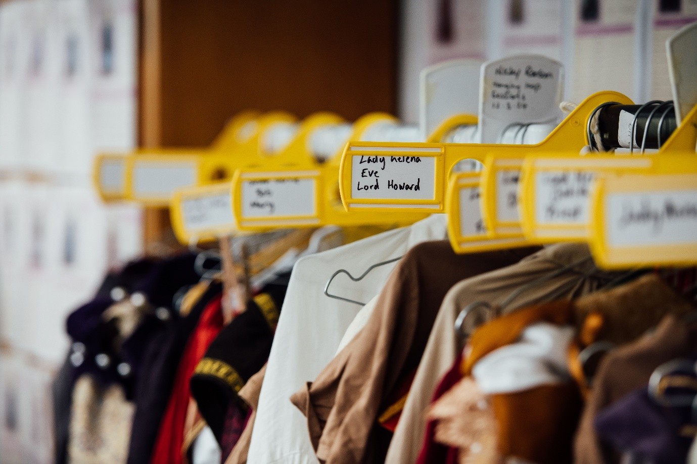 Costumes lined up on a hanger for a performance.
