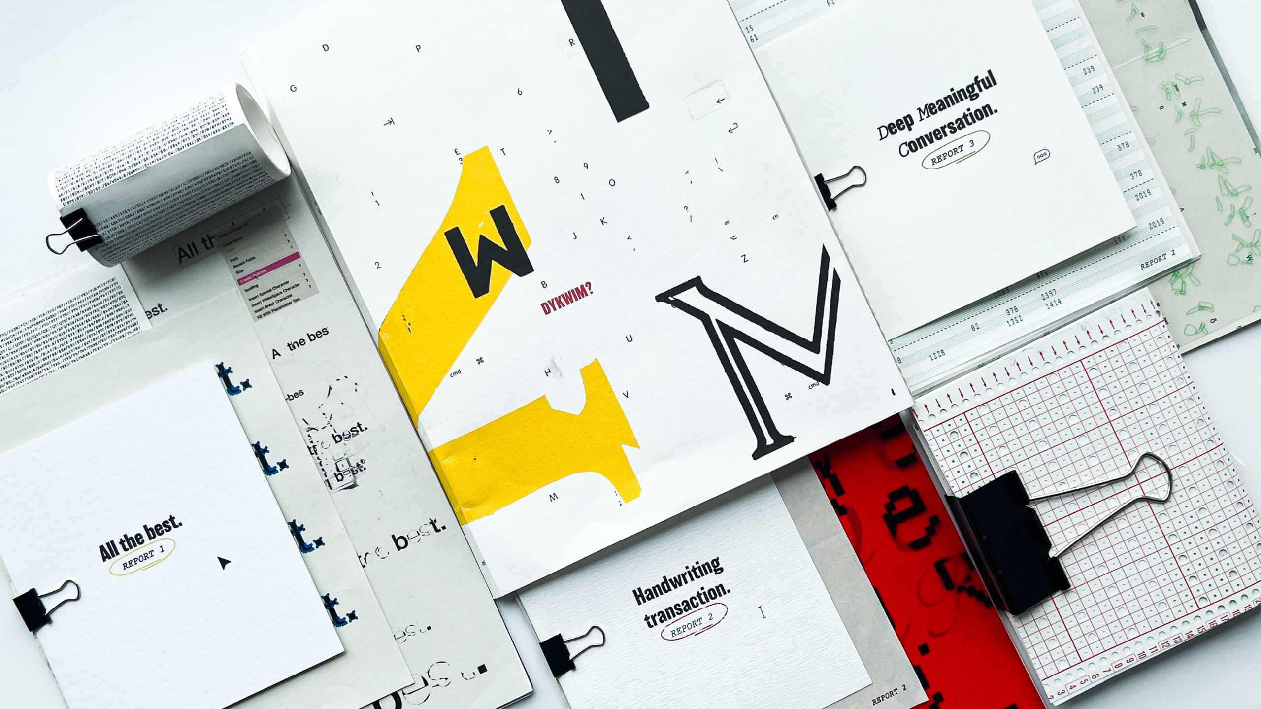 Flat lay of paper and different colour and sized fonts