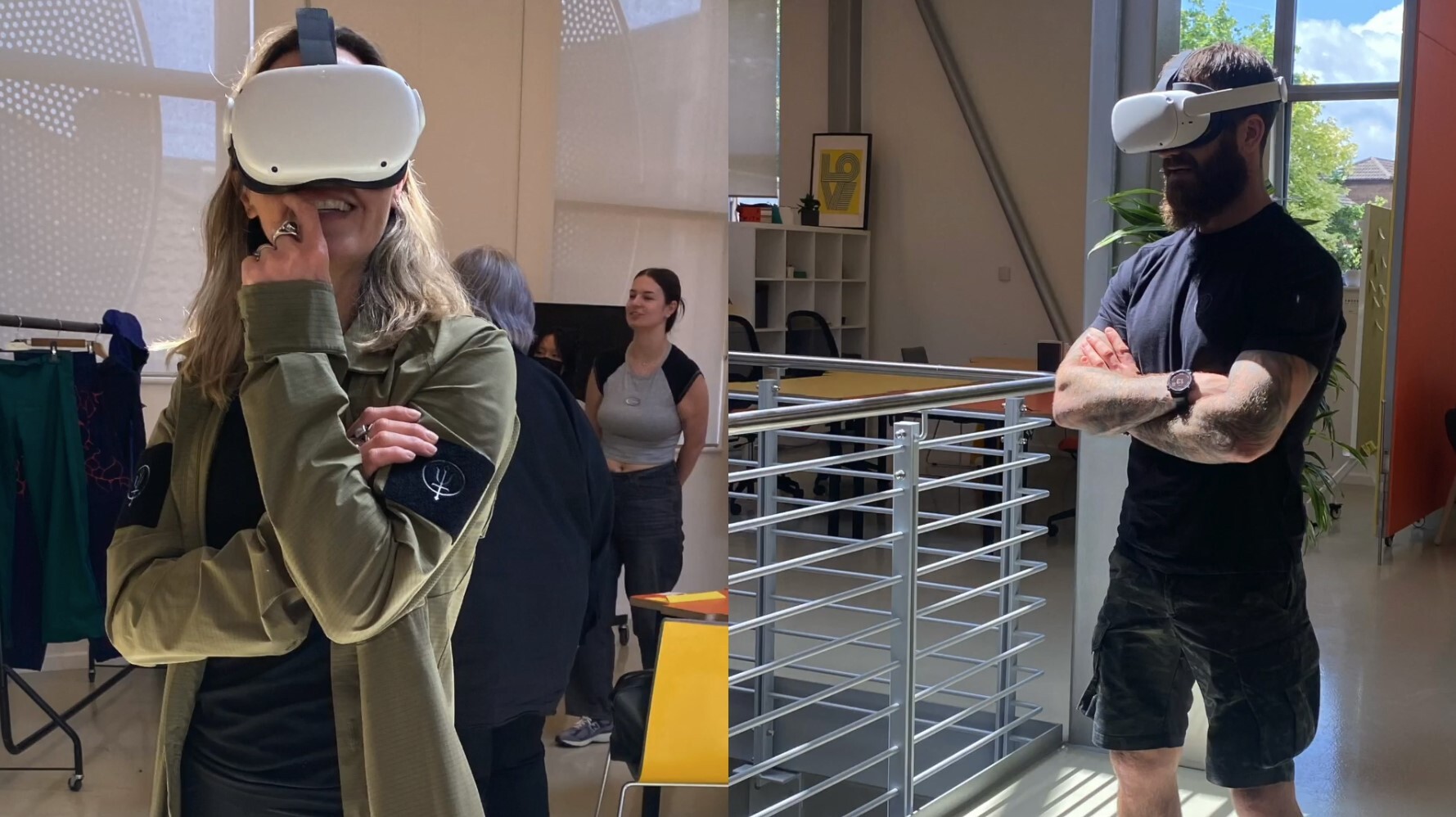 Woman and man wearing VR headsets in modern office space with metal railings and large windows.