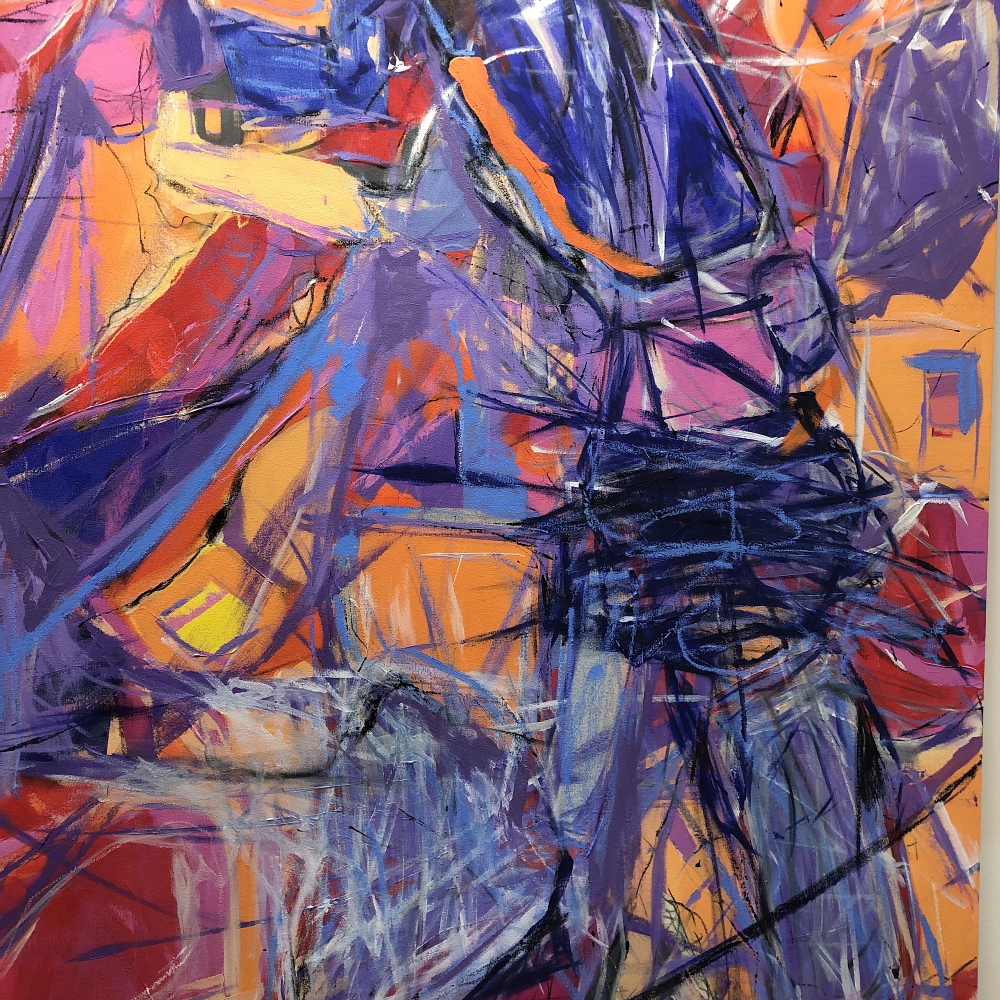 Close-up of part of an abstract painting, mainly made up of purple, orange and blue strokes.